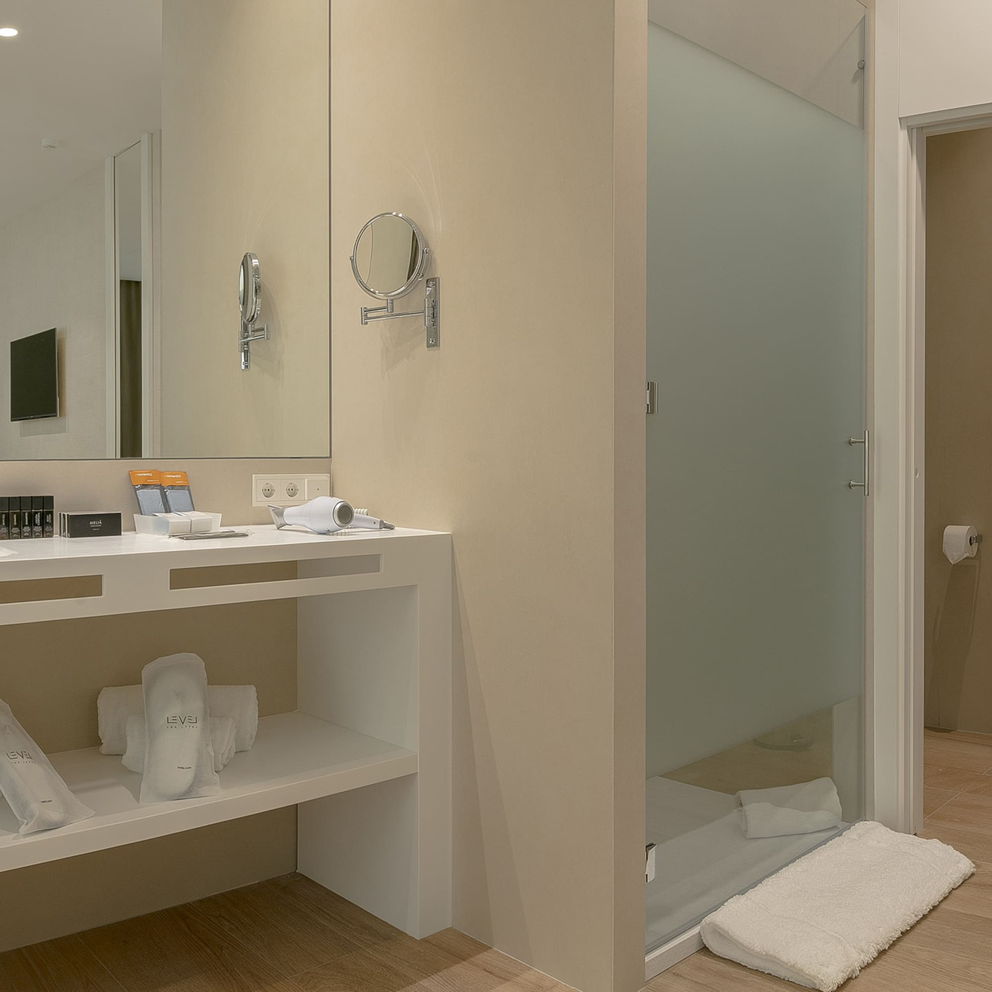 a bathroom with a shower and a mirror