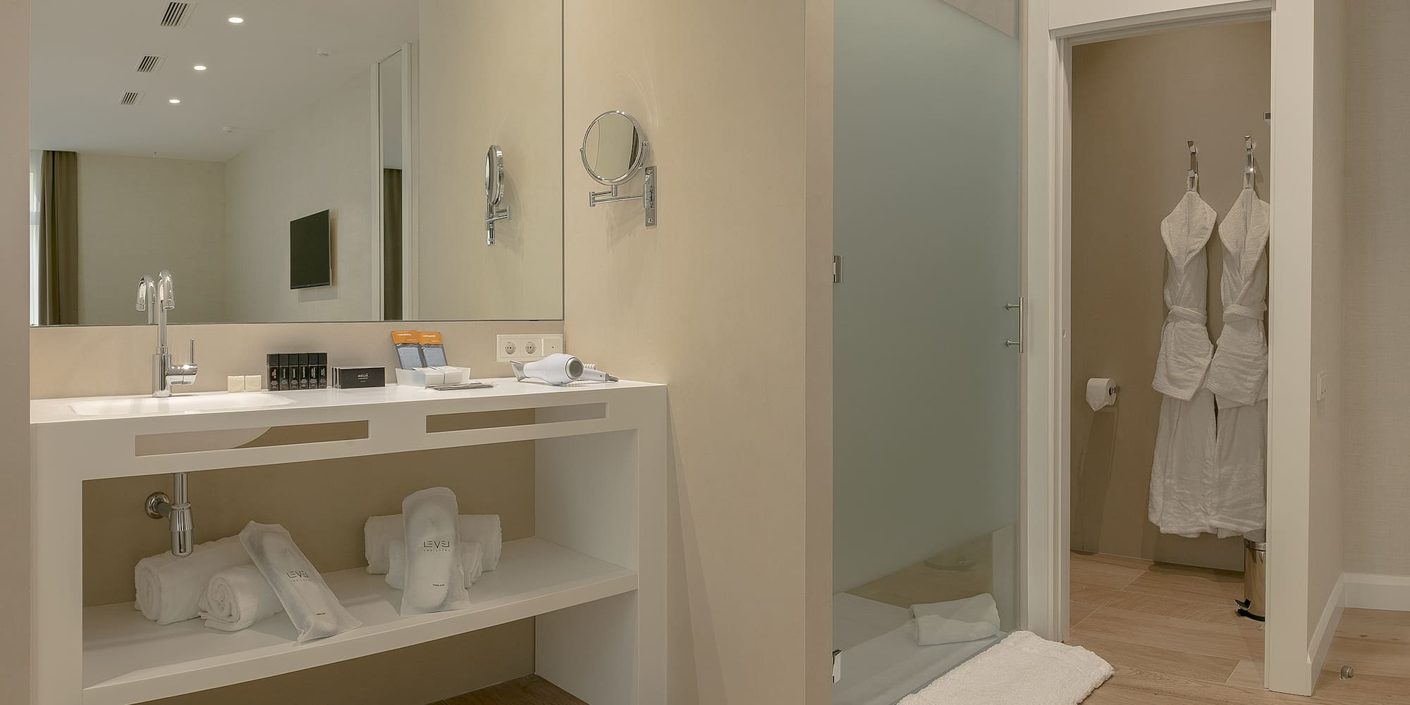 a bathroom with a shower and a mirror