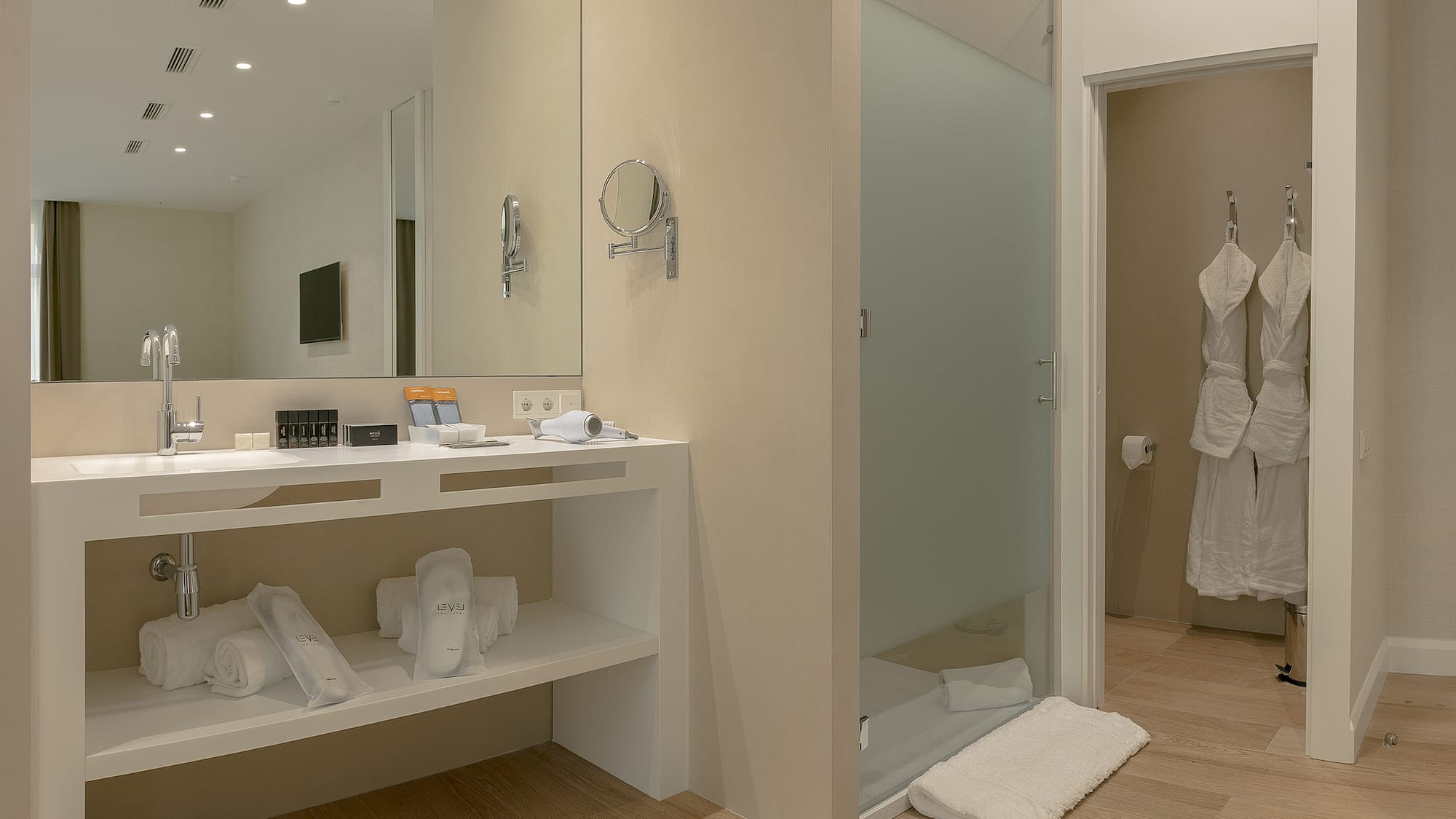 a bathroom with a shower and a mirror