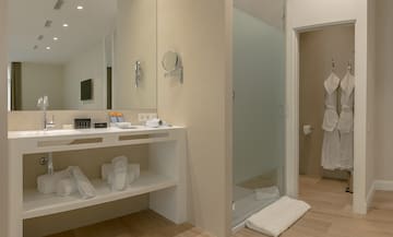 a bathroom with a shower and a mirror