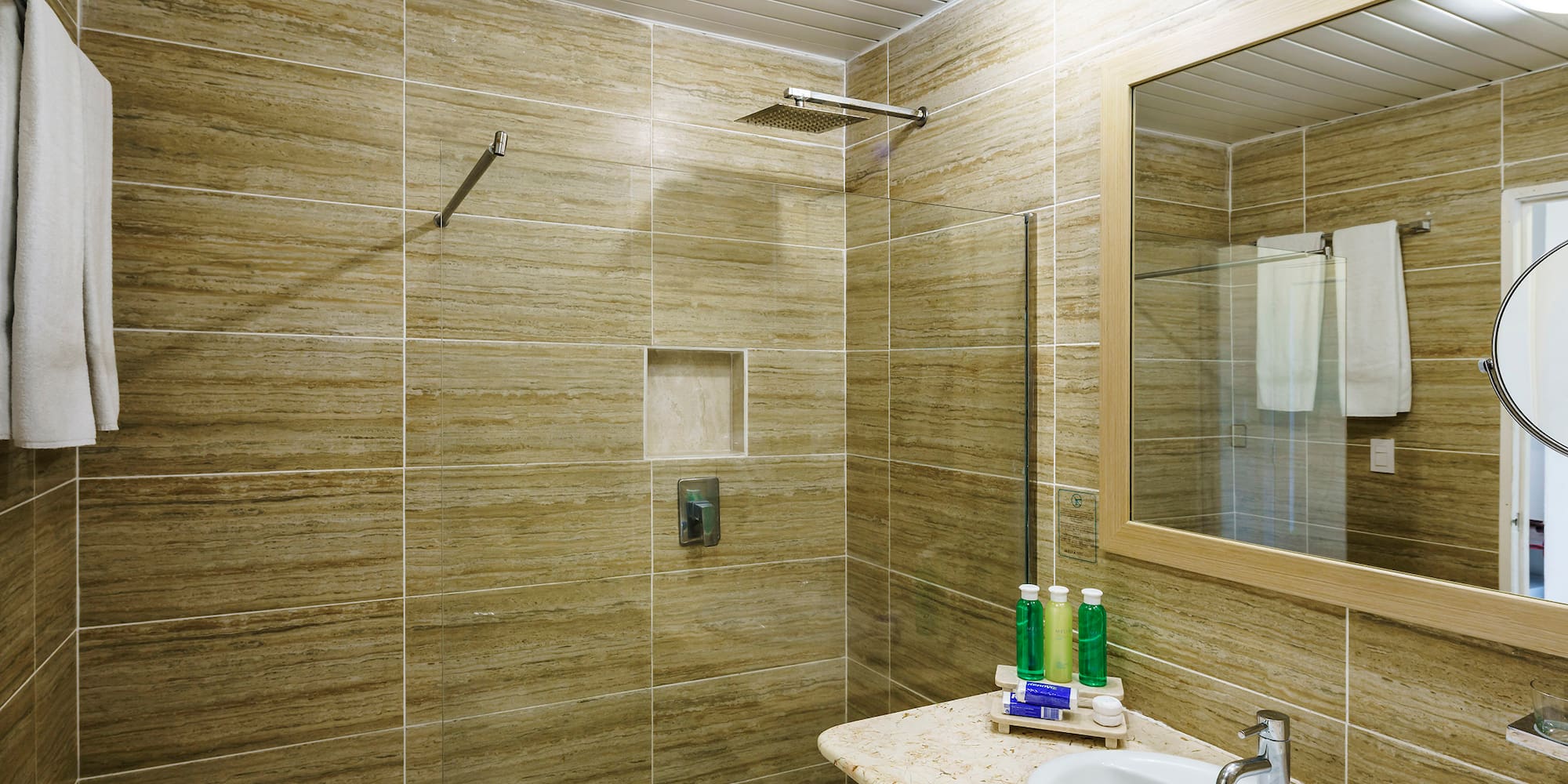 a bathroom with a sink and mirror