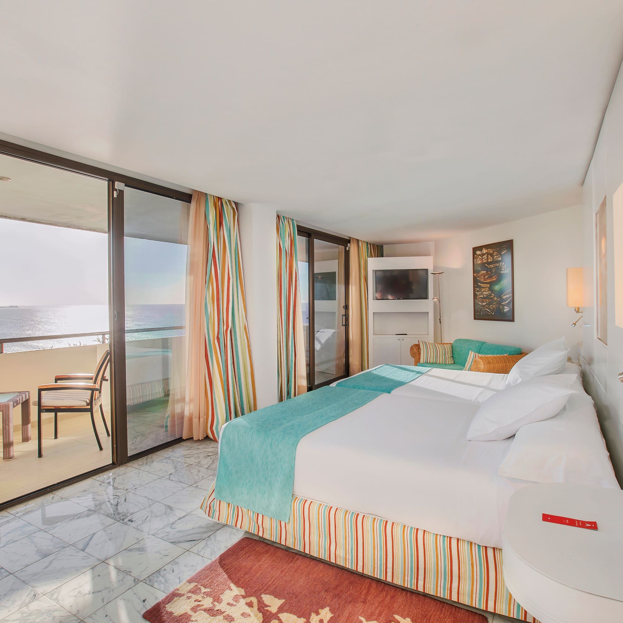 a room with a bed and a glass door