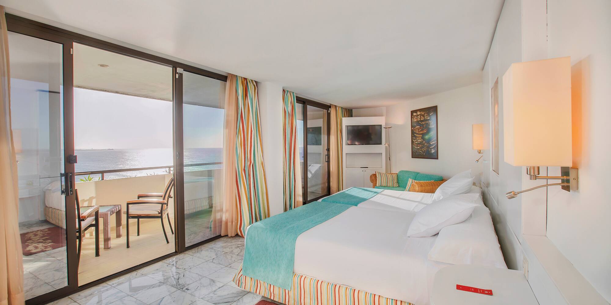 a room with a bed and a glass door