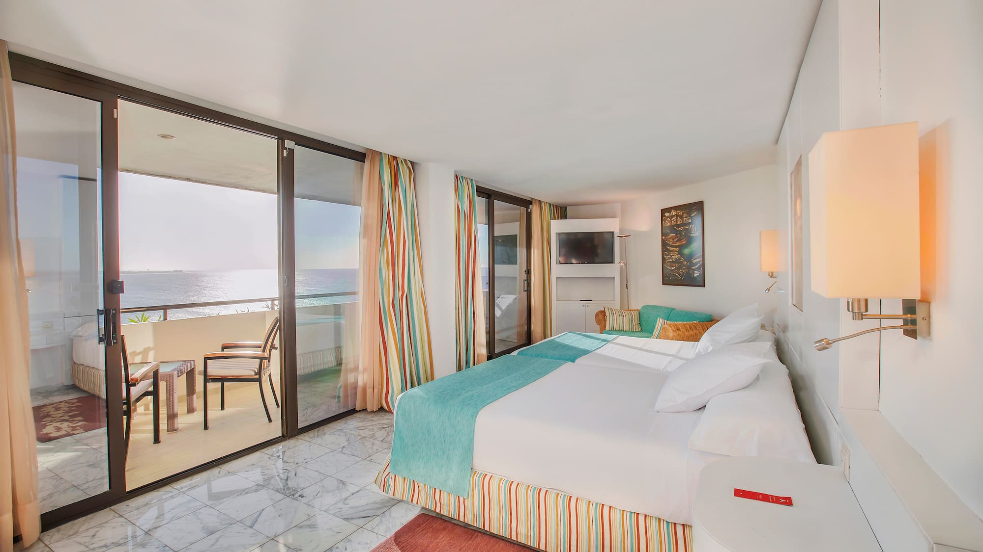 a room with a bed and a glass door