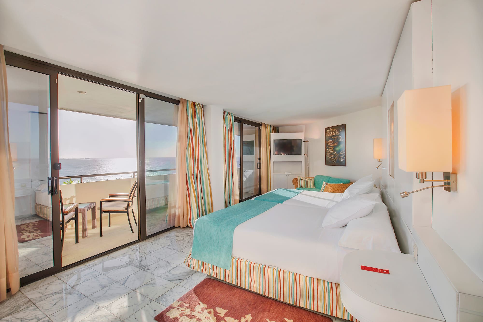 a room with a bed and a glass door