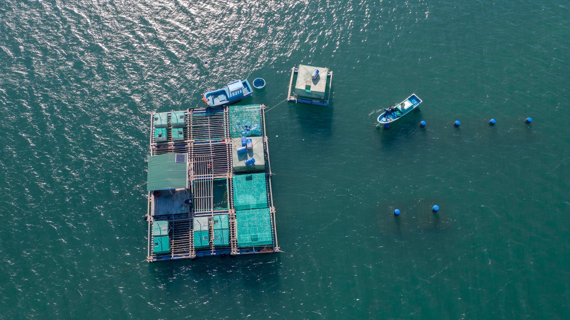 a floating platform with boats in the water