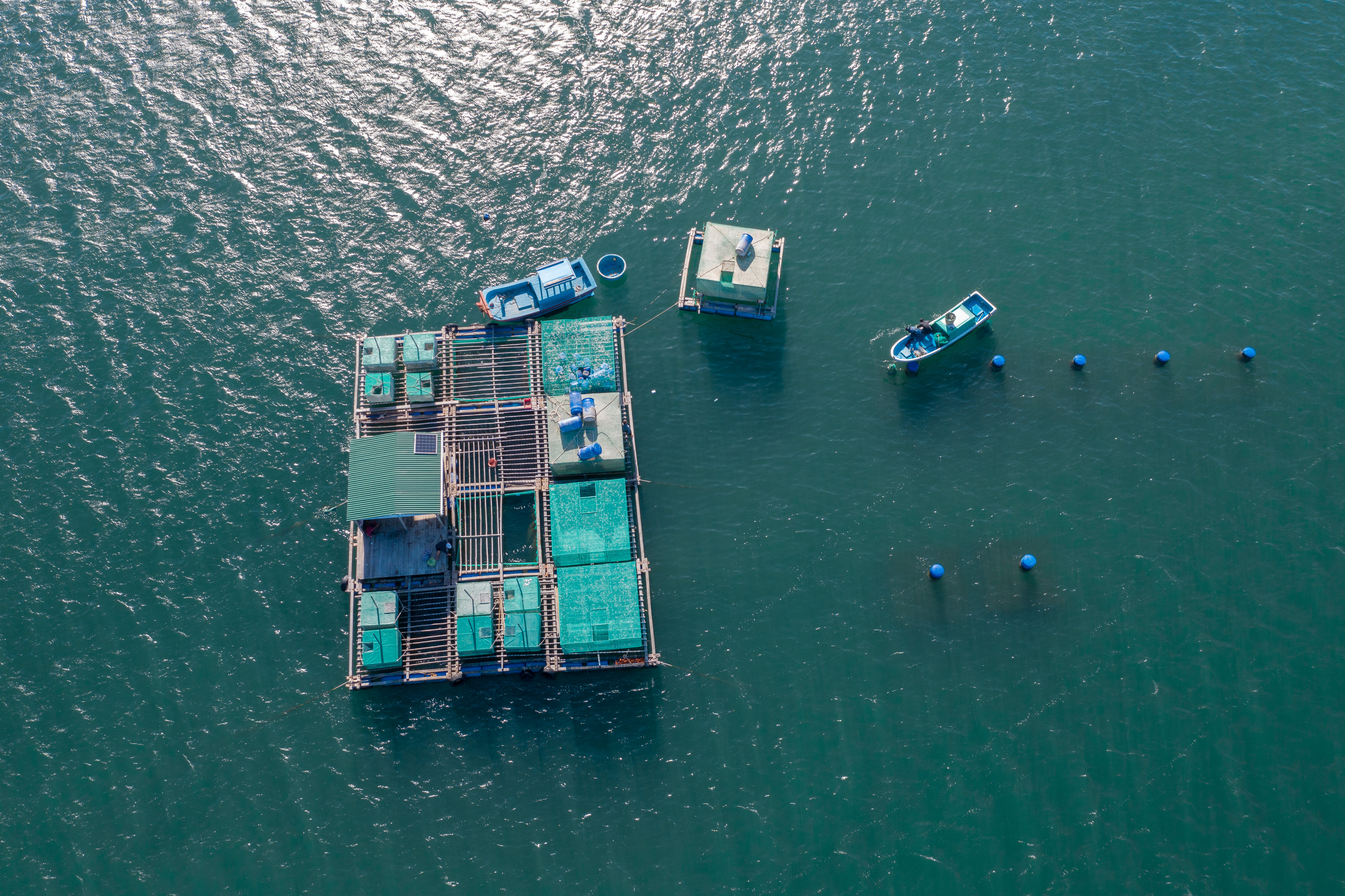 a floating platform with boats in the water