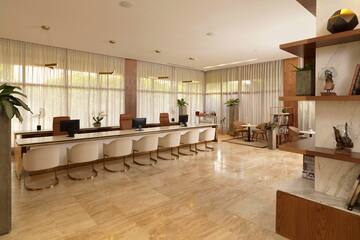 a room with a large table and chairs