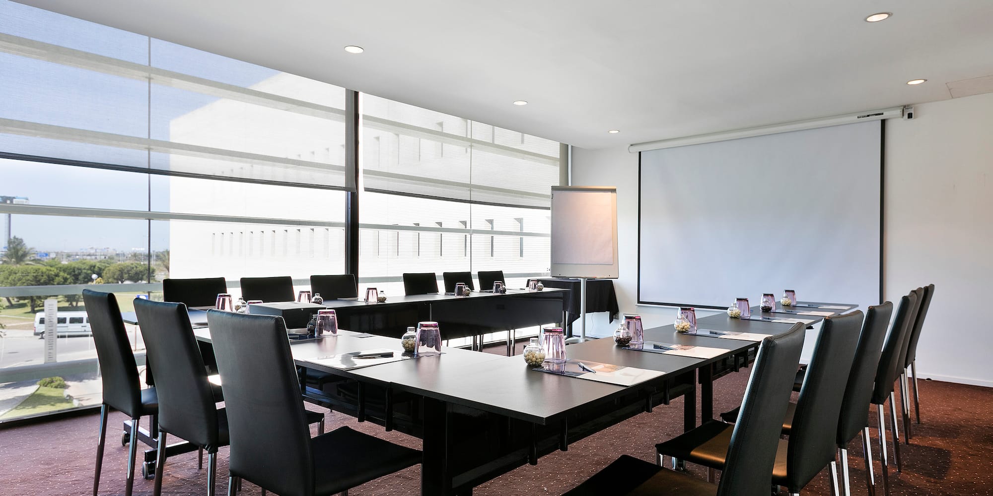 a room with a large table and chairs