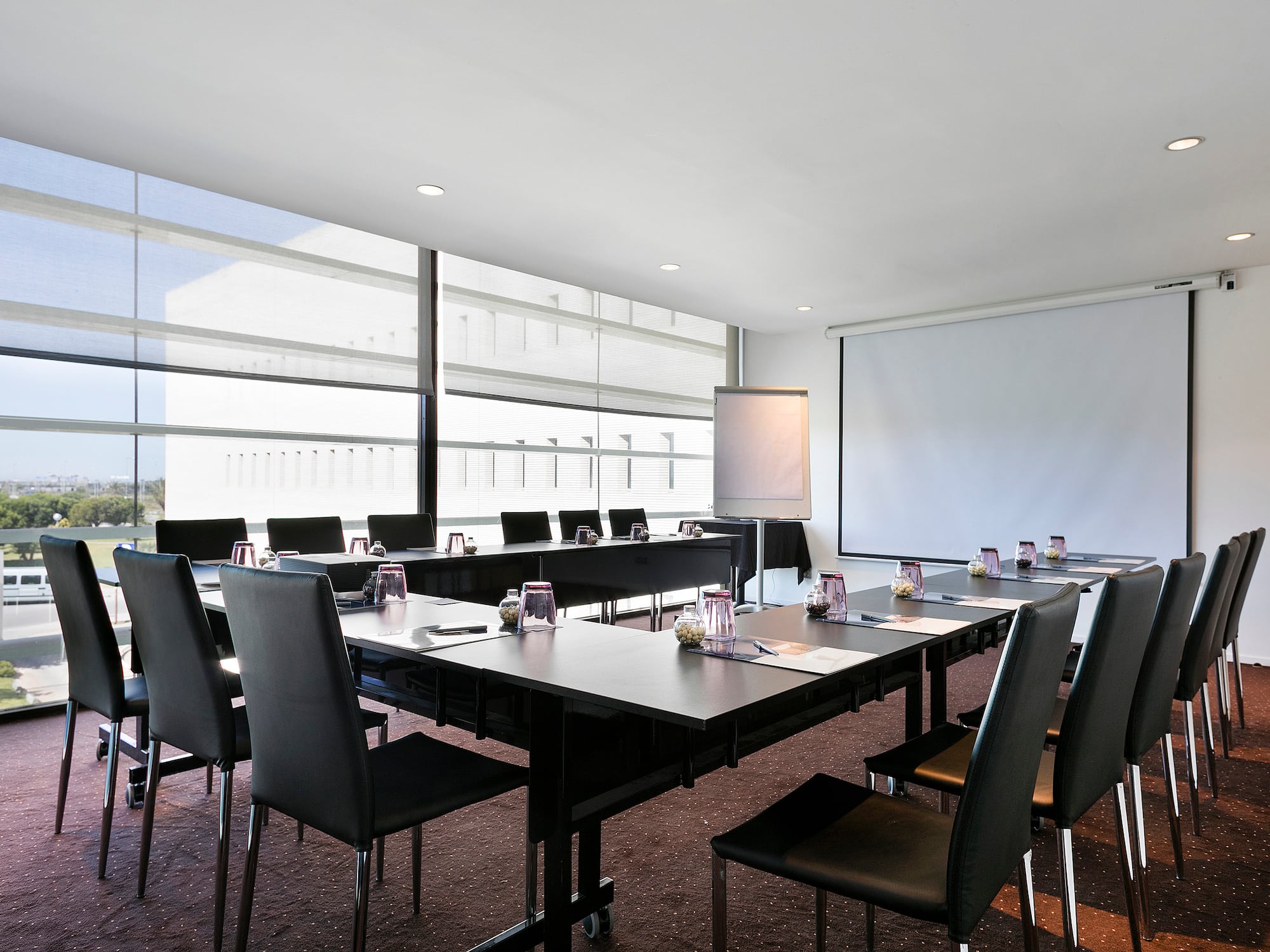 a room with a large table and chairs