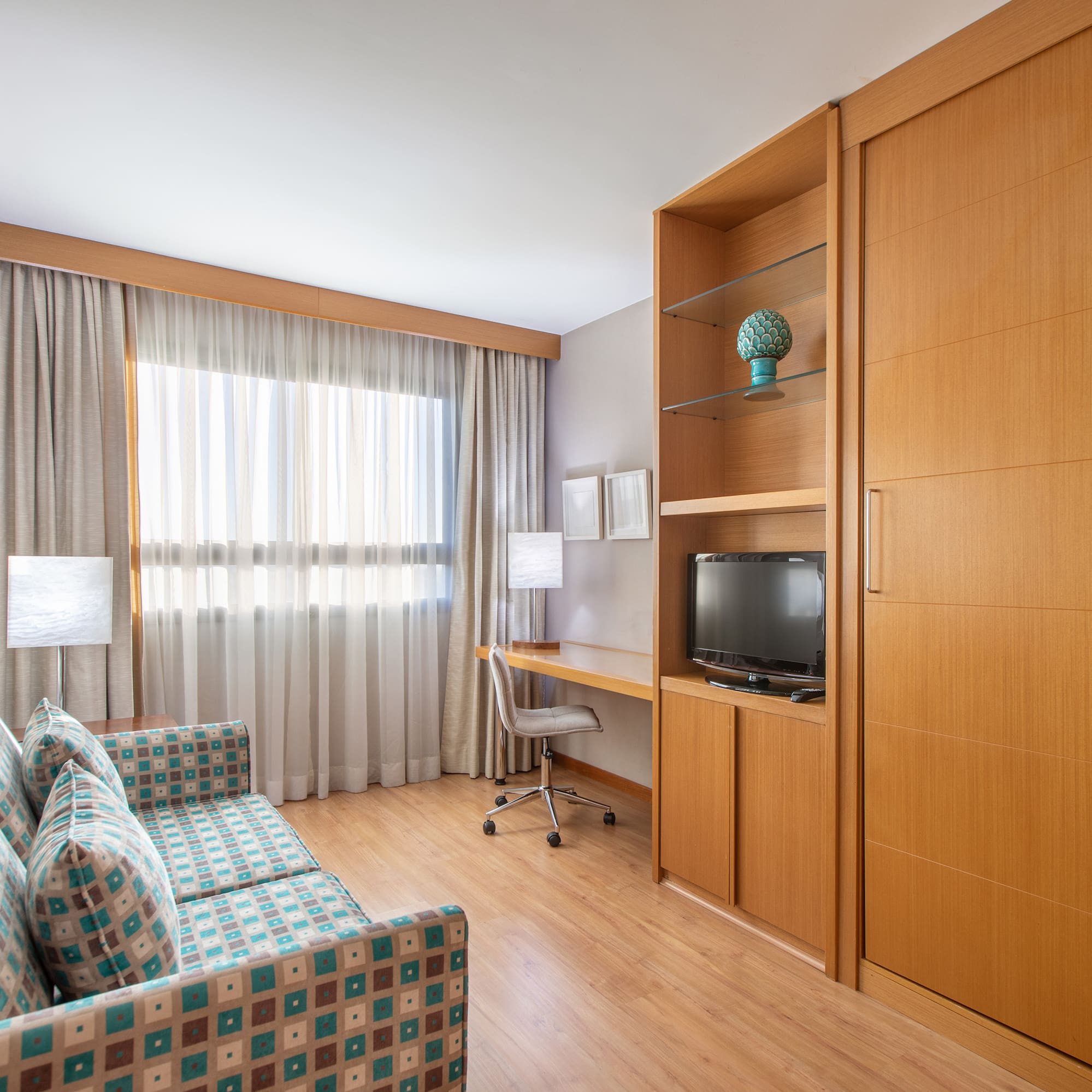 a room with a couch and a desk