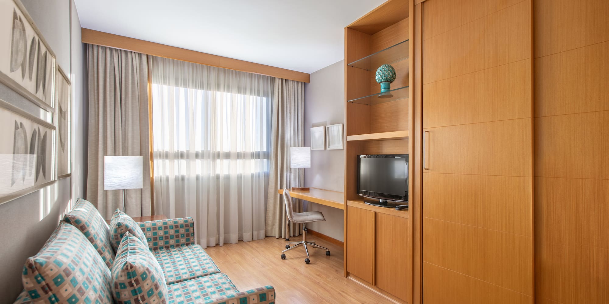 a room with a couch and a desk