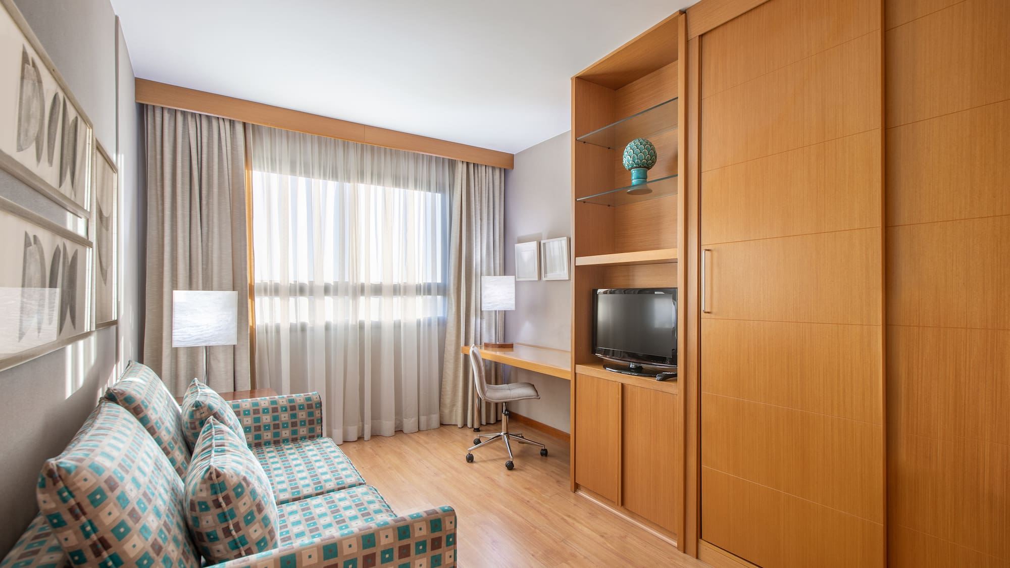 a room with a couch and a desk