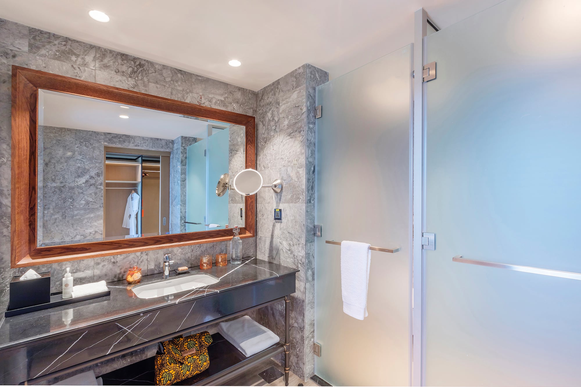 a bathroom with a mirror and sink