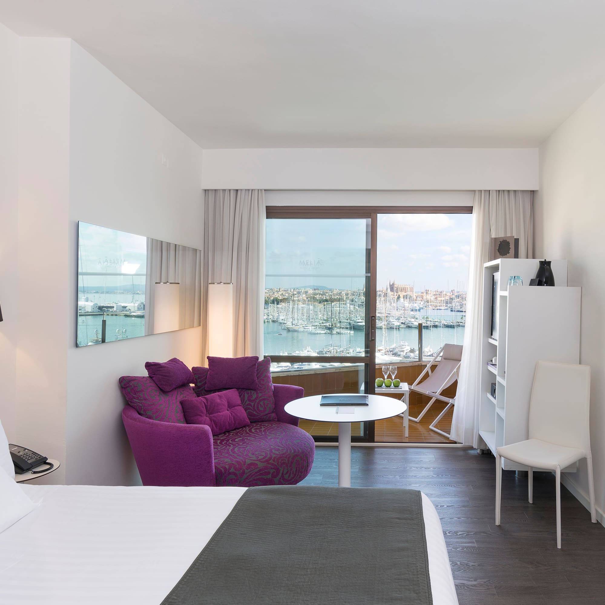 a room with a bed and a chair