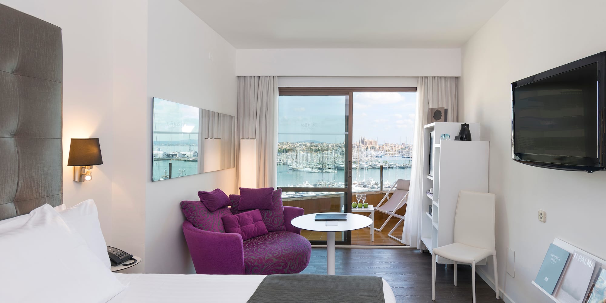 a room with a bed and a chair