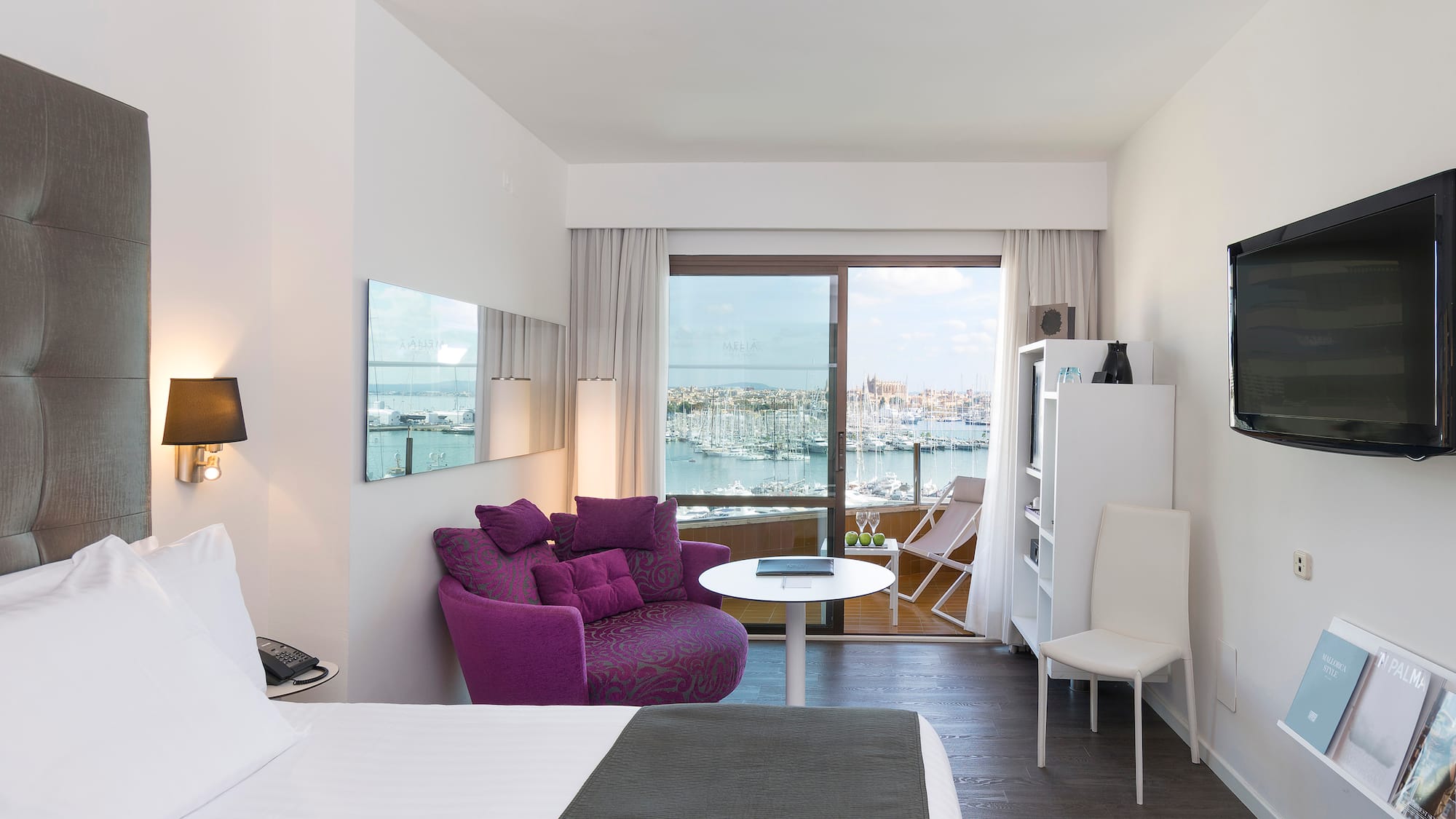 a room with a bed and a chair