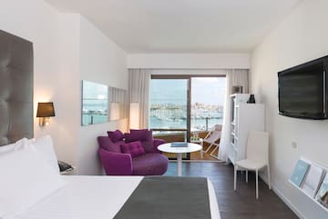 a room with a bed and a chair