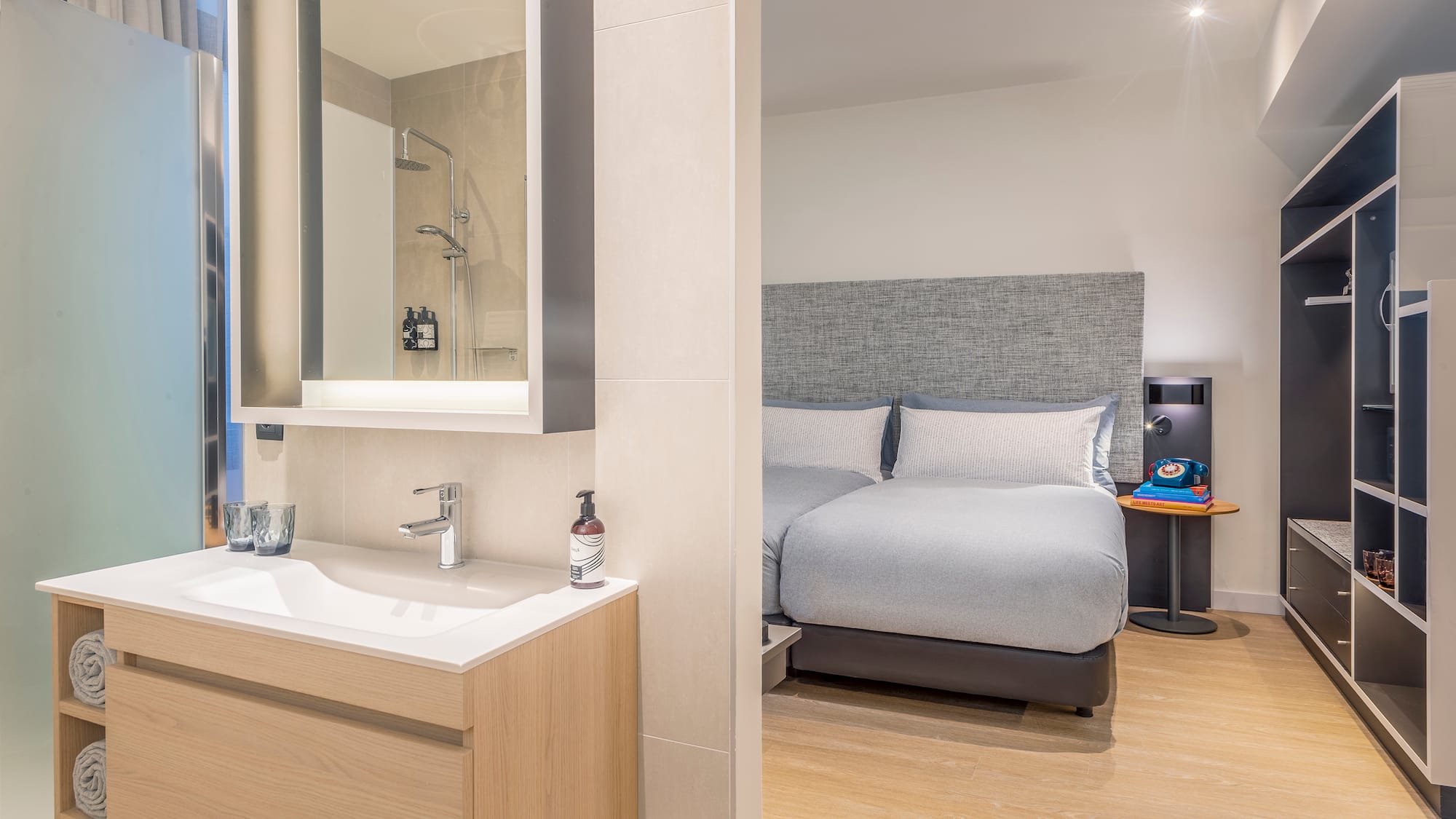 a bathroom with a bed and sink