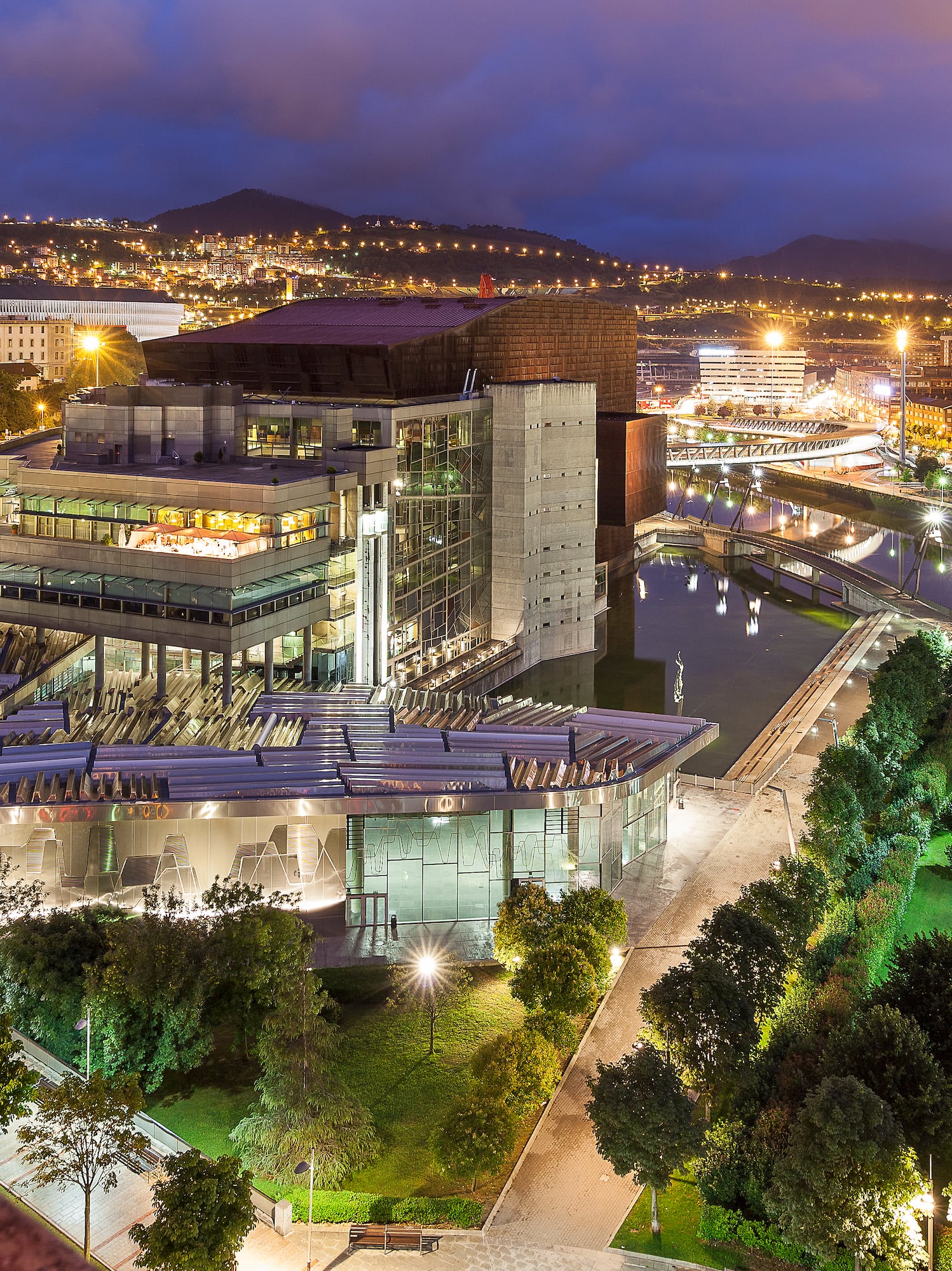 a city with a large building and trees