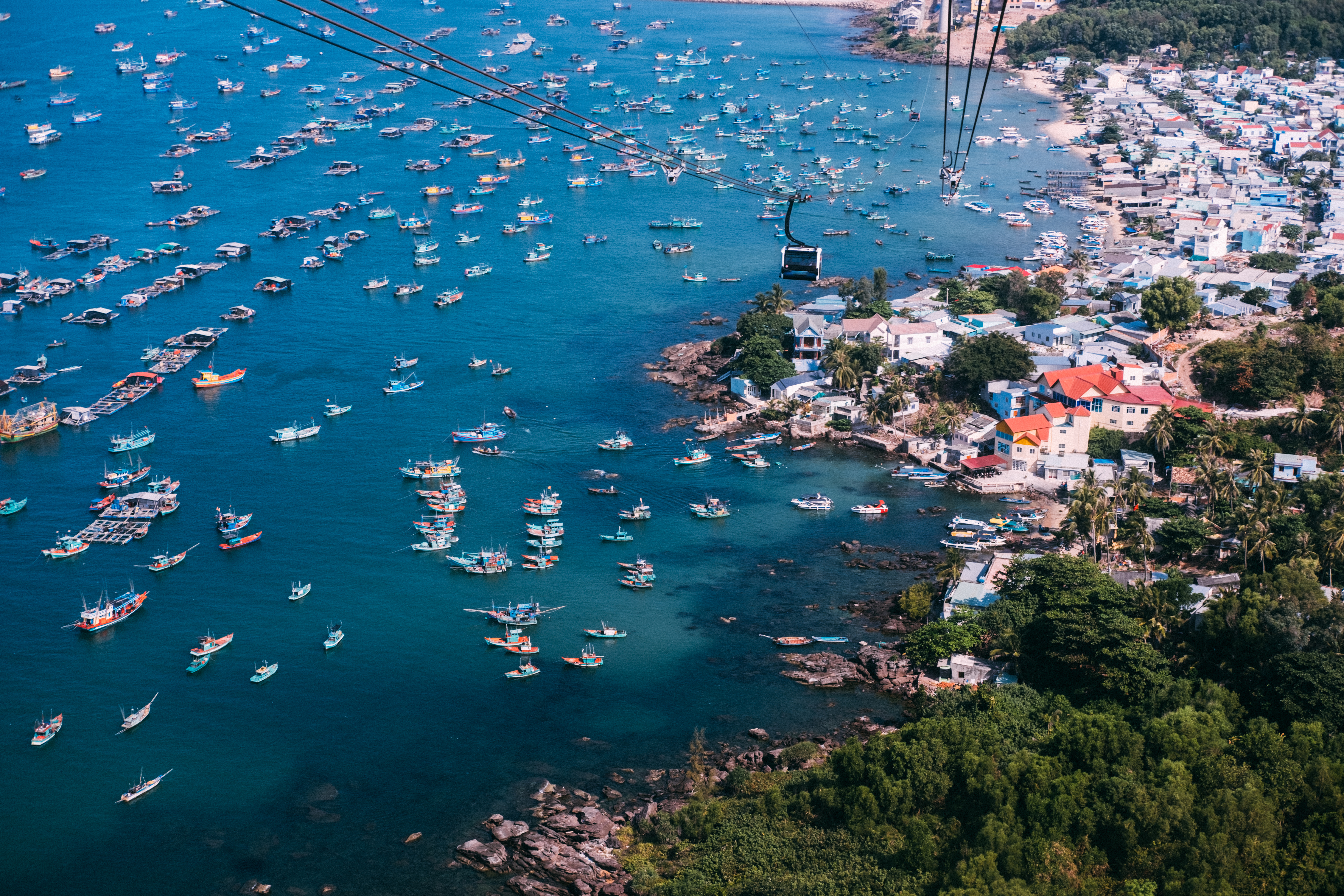 a aerial view of a body of water with boats and buildings