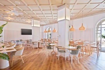 a room with tables and chairs