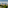 Scenic golf resort with colorful Mediterranean village and rugged mountains.
