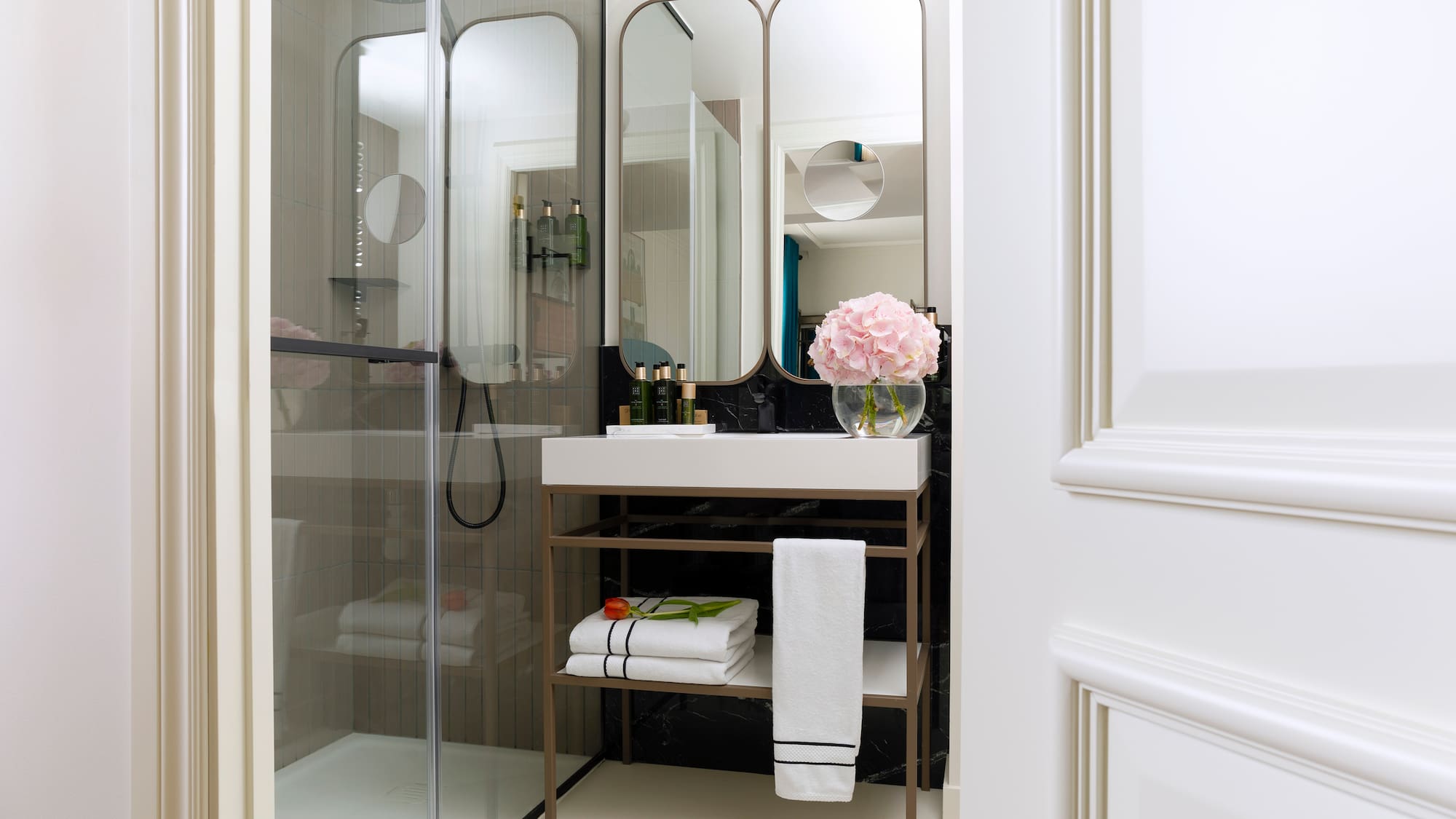 a bathroom with a mirror and a sink