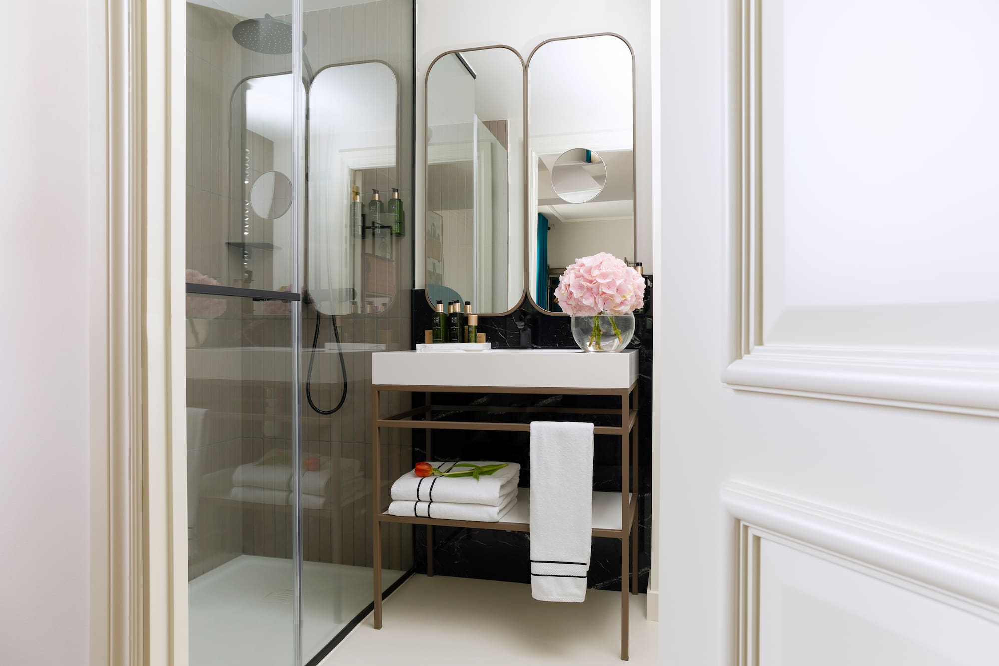 a bathroom with a mirror and a sink