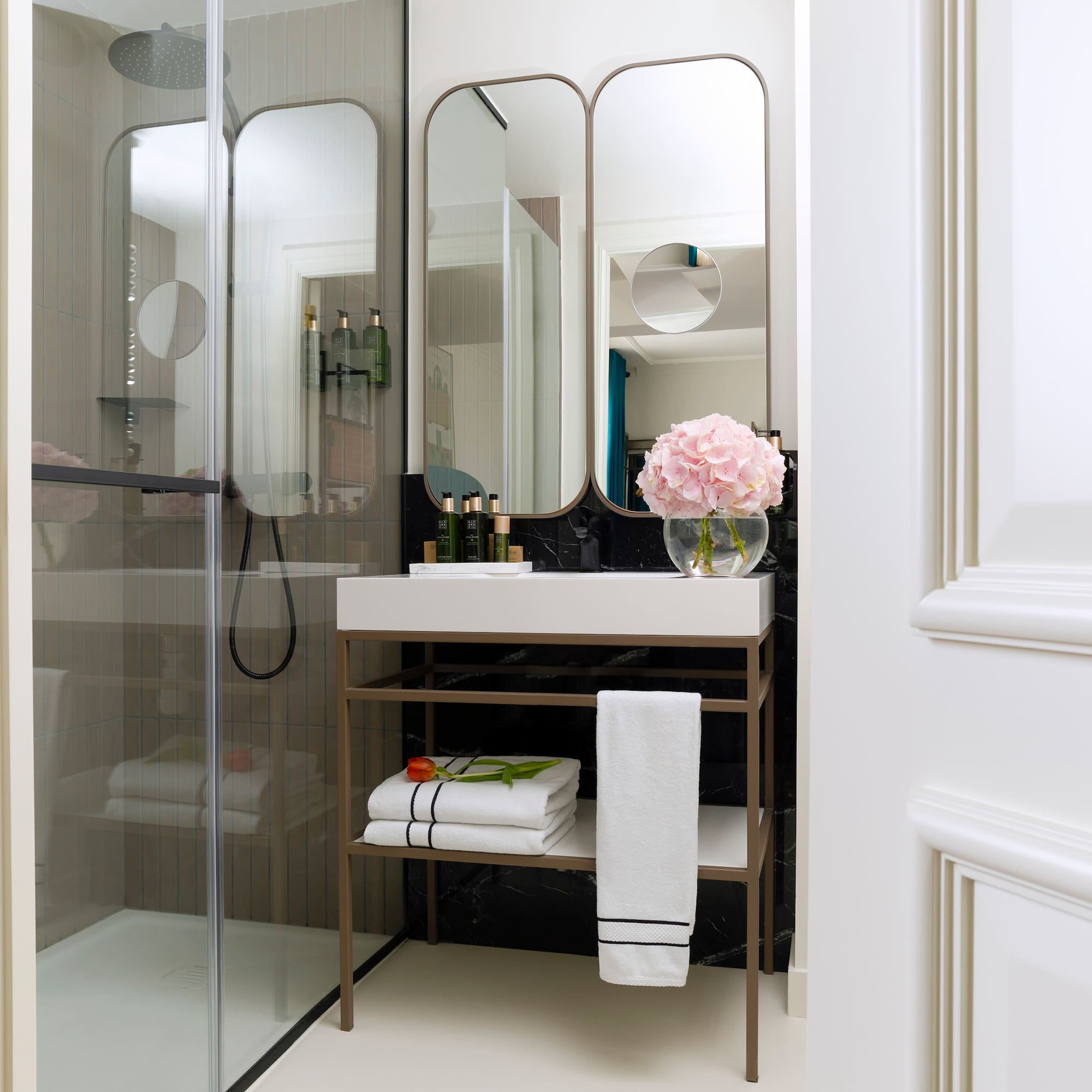 a bathroom with a mirror and a sink