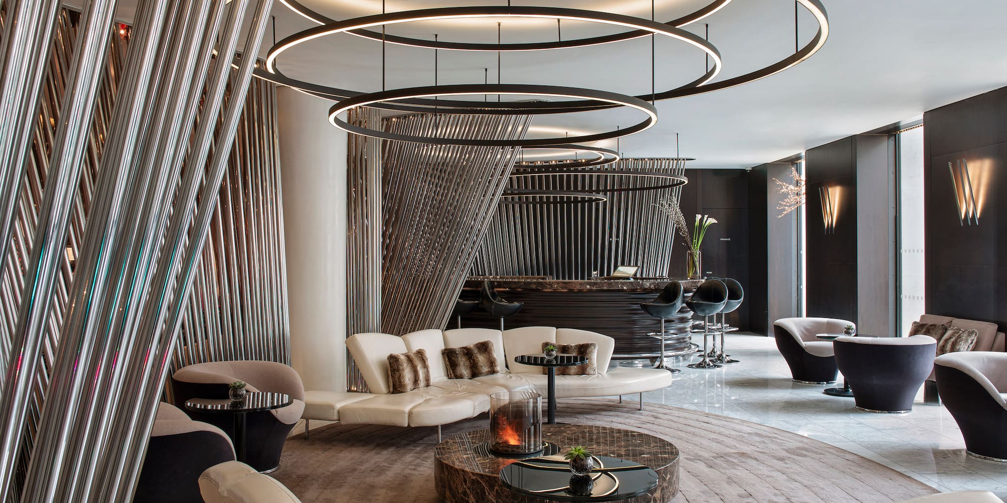 a room with a round table and chairs