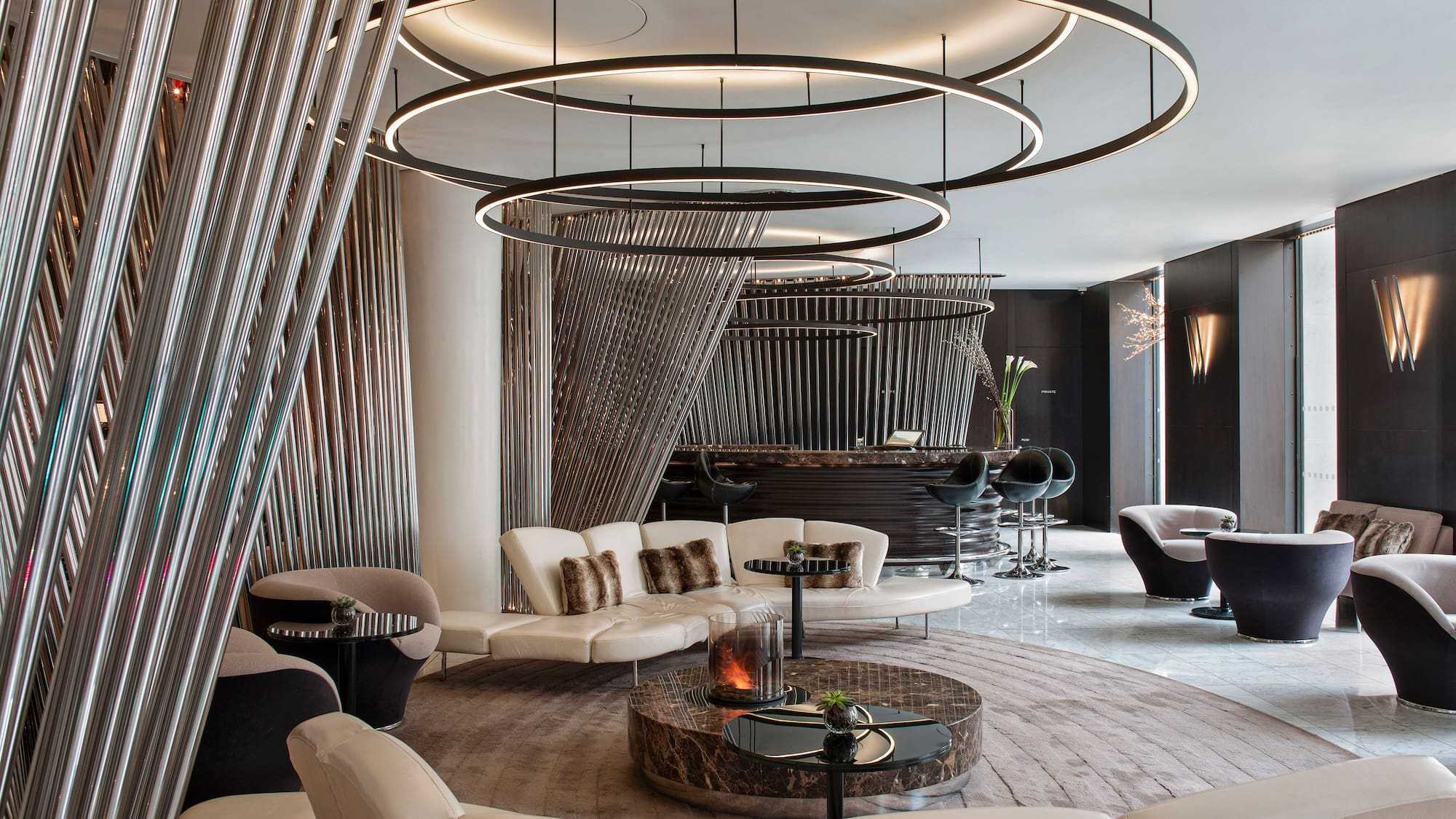 a room with a round table and chairs