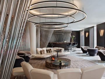 a room with a round table and chairs