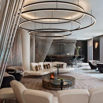 a room with a round table and chairs
