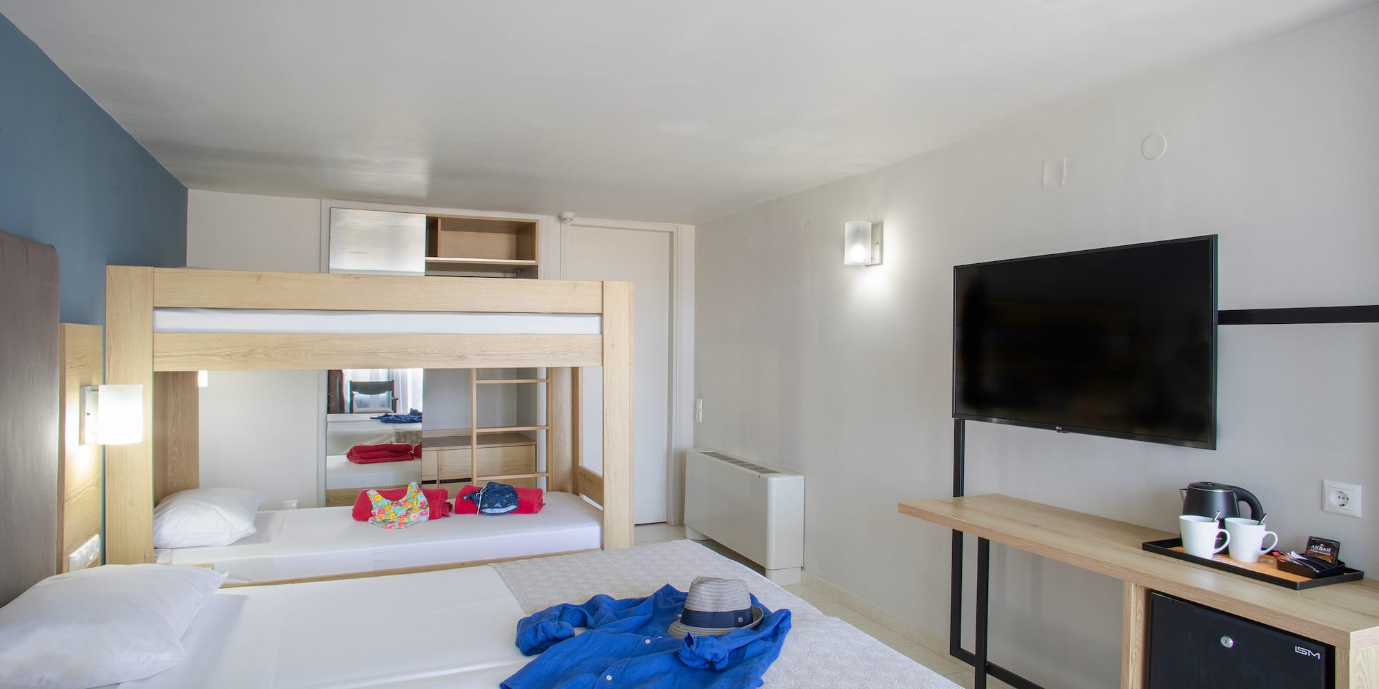 a room with a bed and a tv