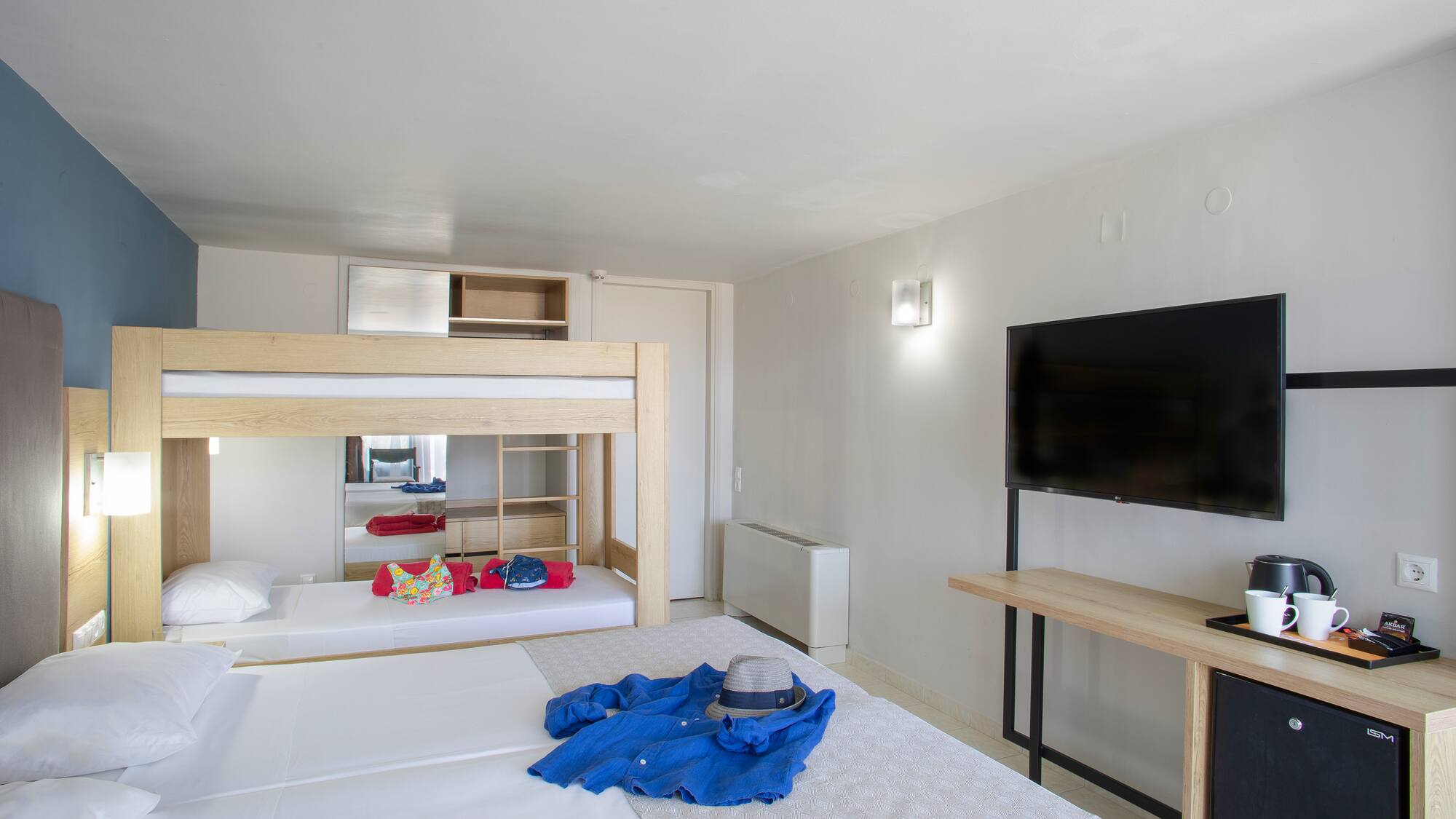 a room with a bed and a tv