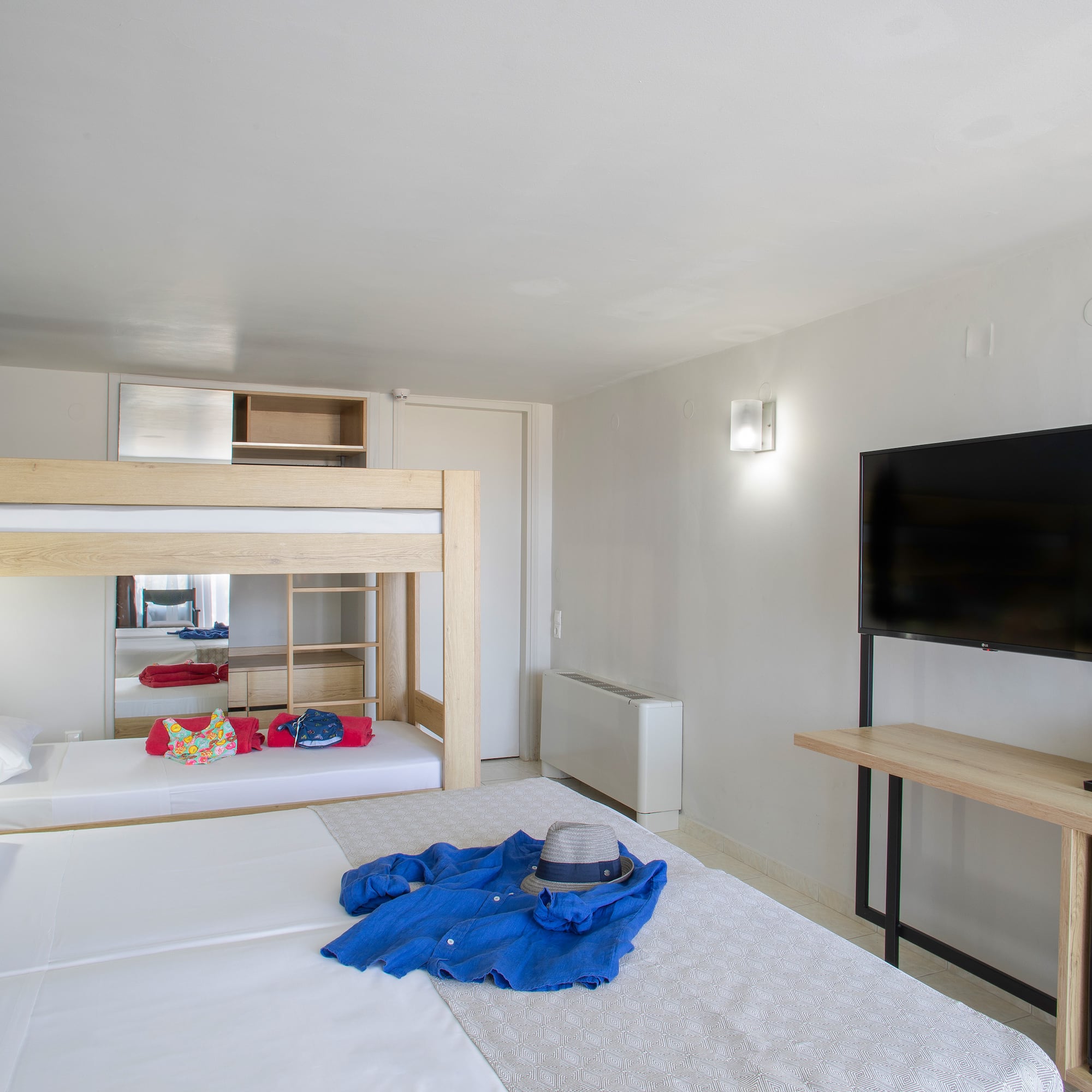 a room with a bed and a tv