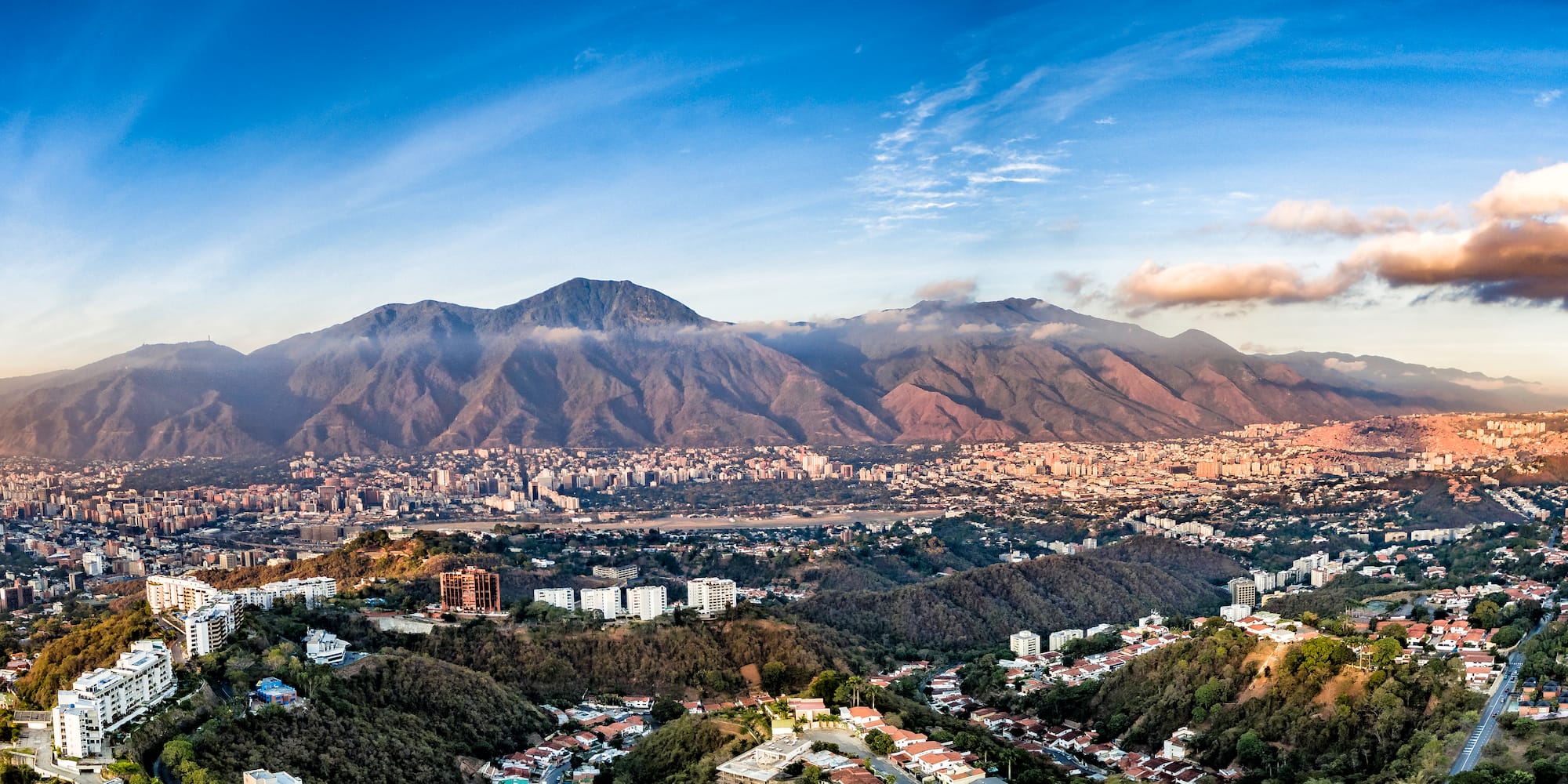 a city with mountains in the background