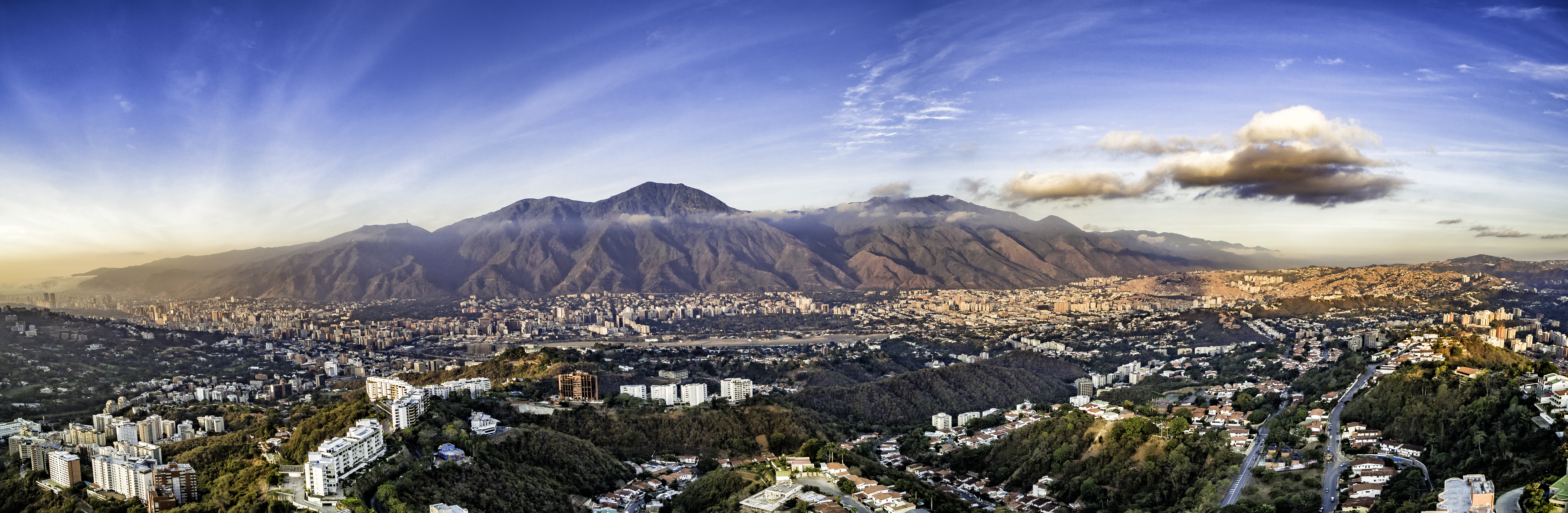 a city with mountains in the background