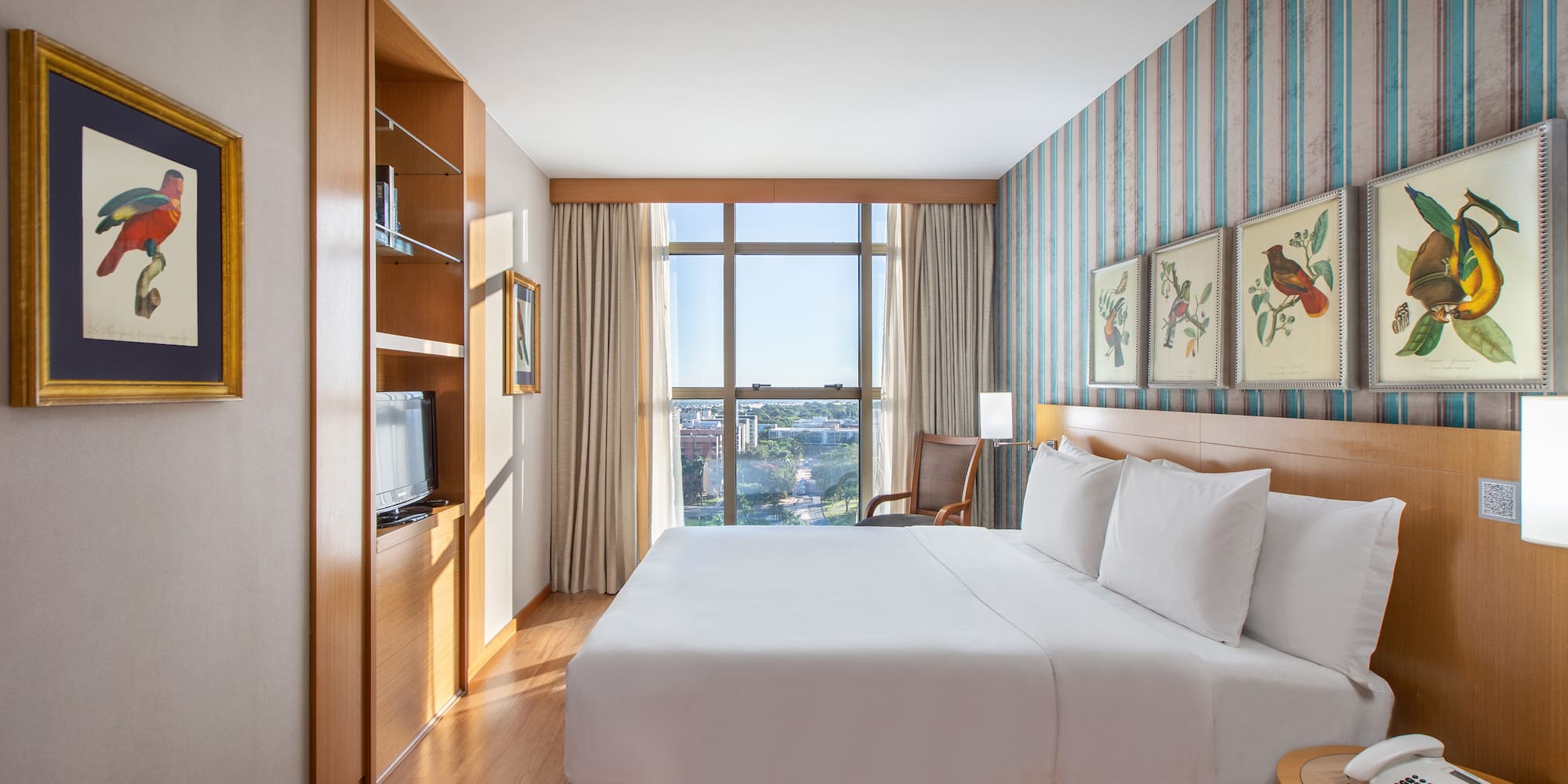 a room with a bed and a television