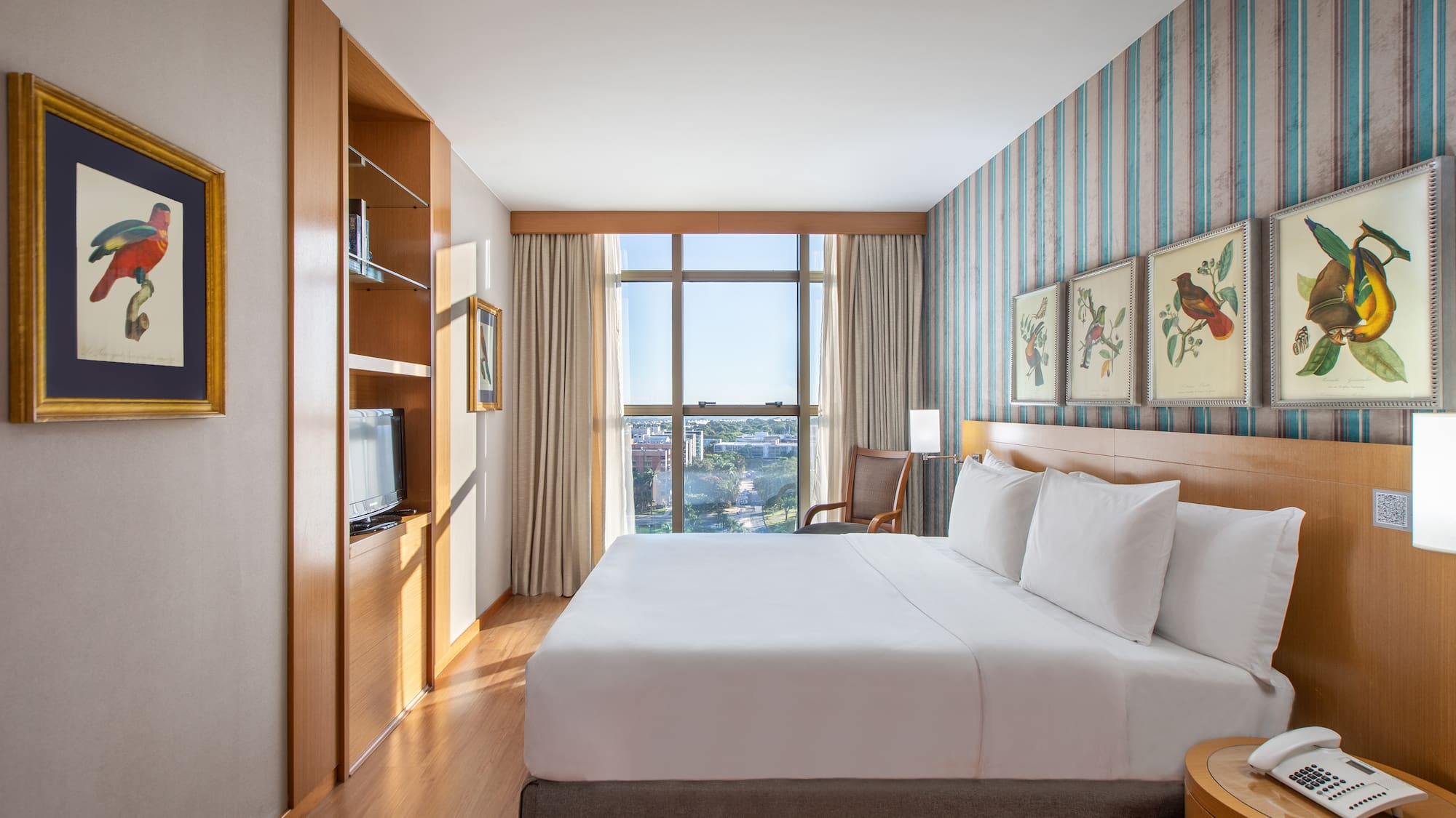 a room with a bed and a television