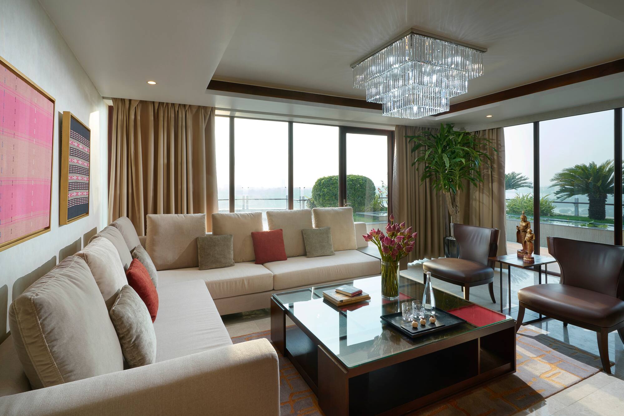 a living room with couches and a glass coffee table