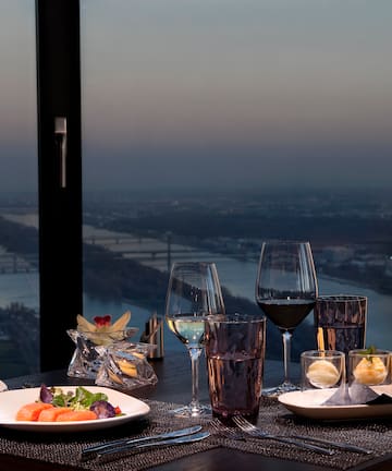 a table with food and wine glasses on it