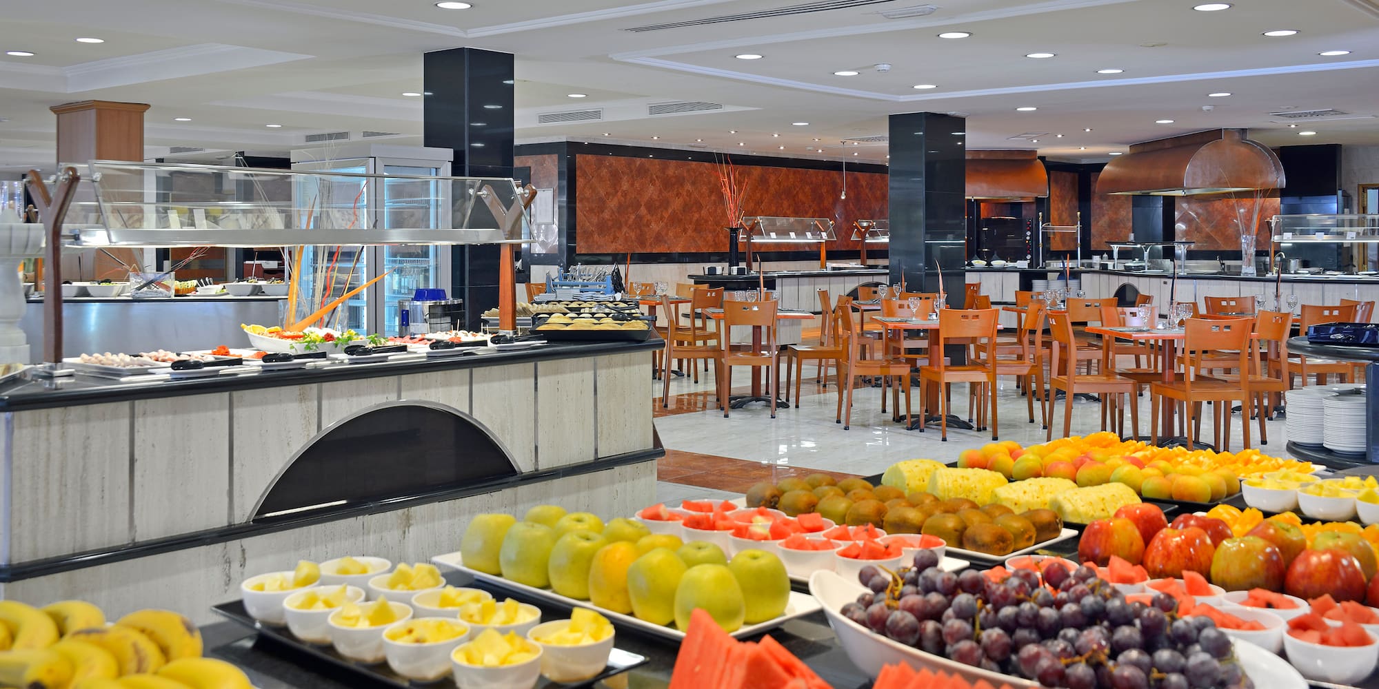 a buffet with fruit on the counter