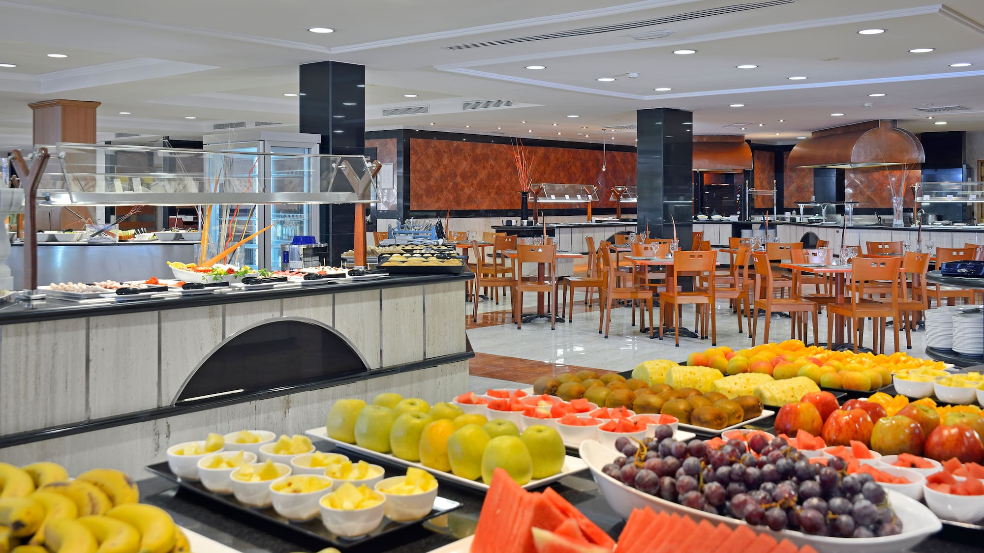 a buffet with fruit on the counter