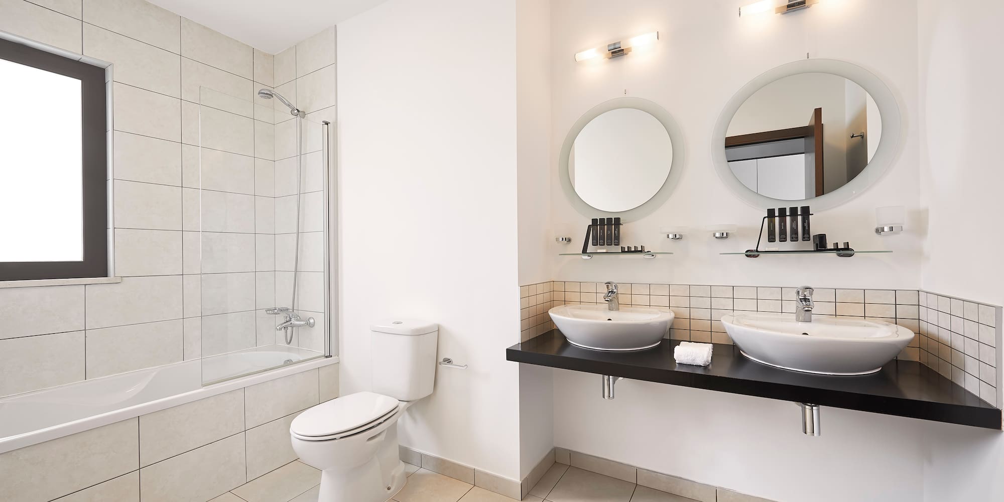a bathroom with white walls and white tile floor