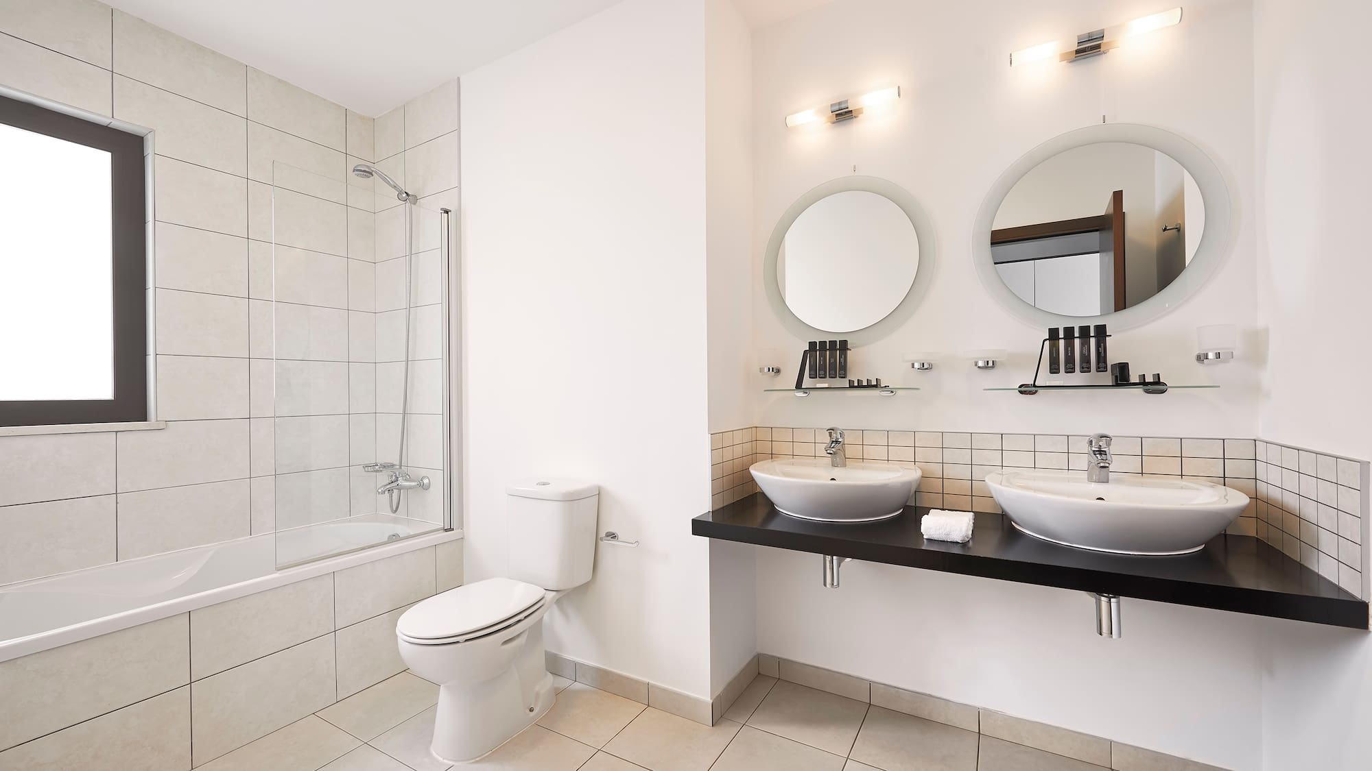 a bathroom with white walls and white tile floor