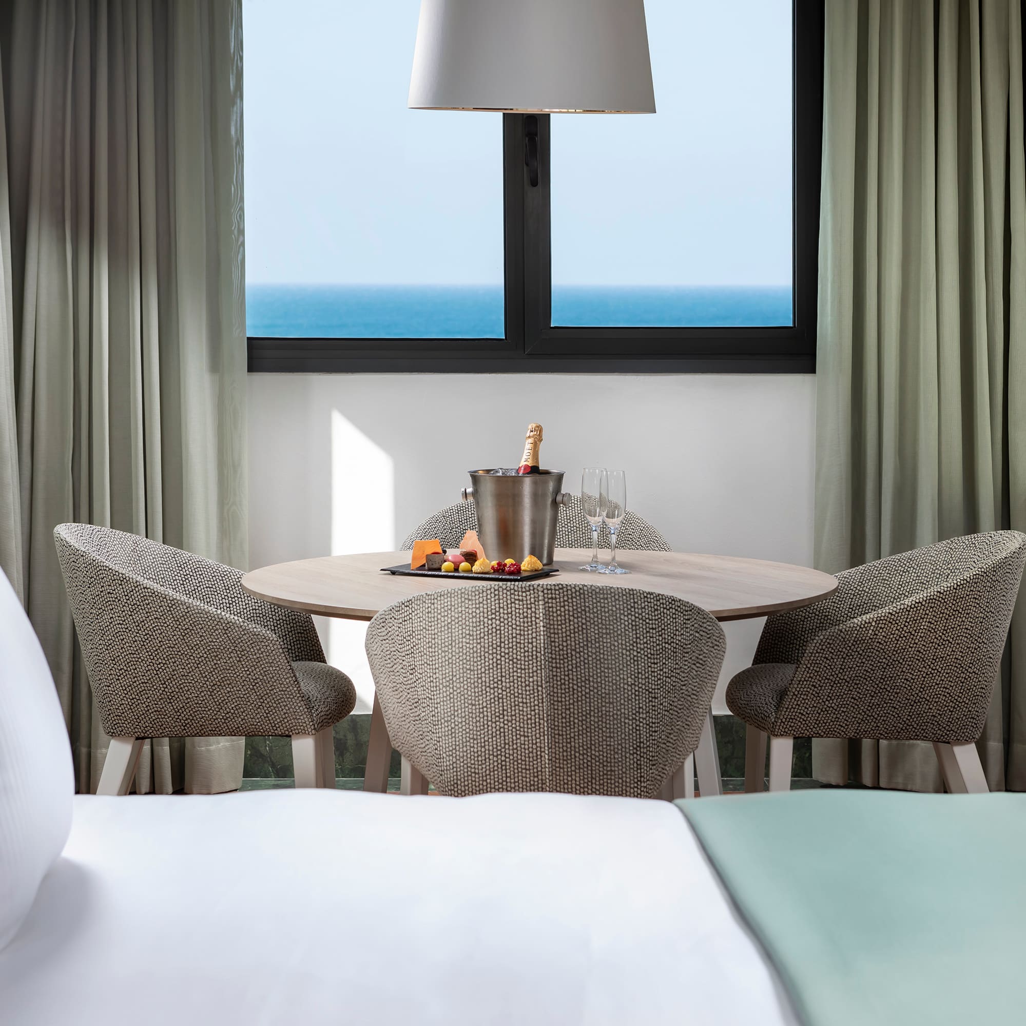 a table with food and chairs in a hotel room