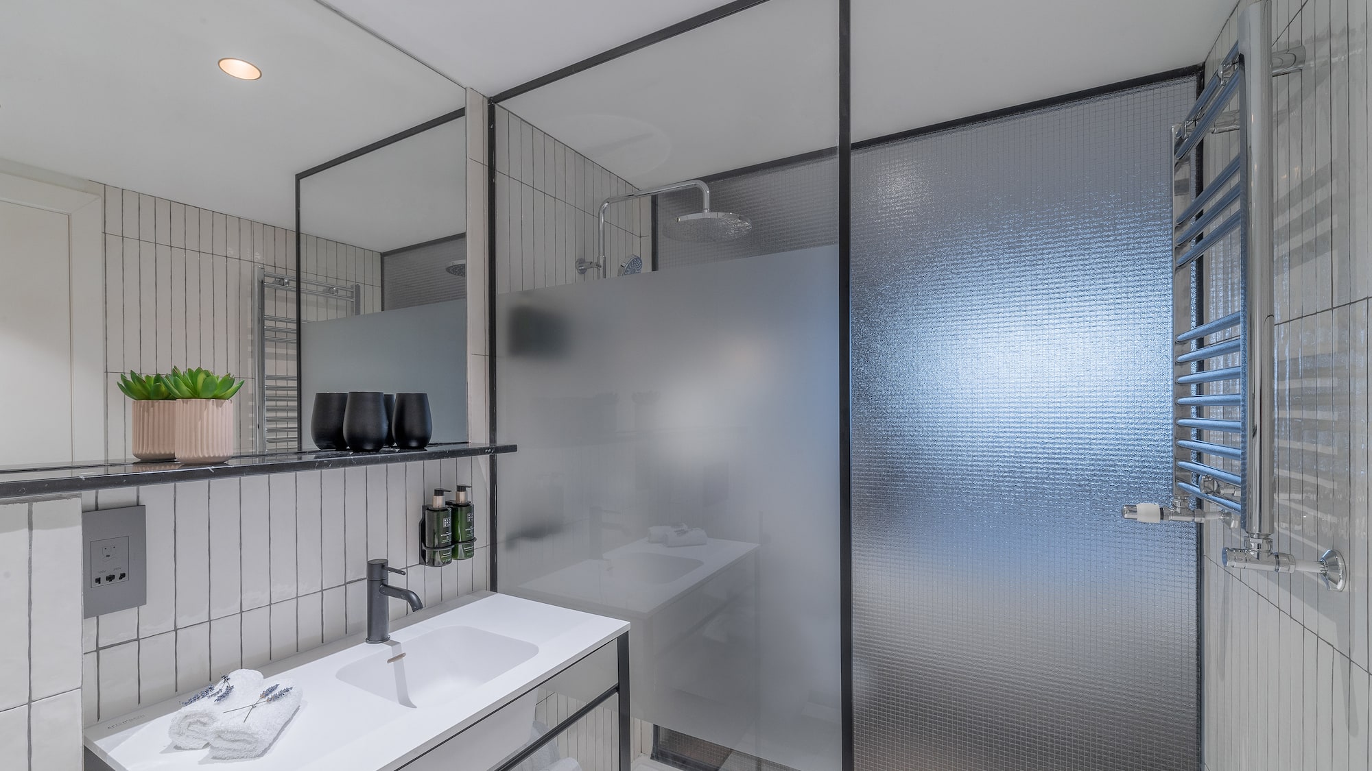 a bathroom with a shower and sink