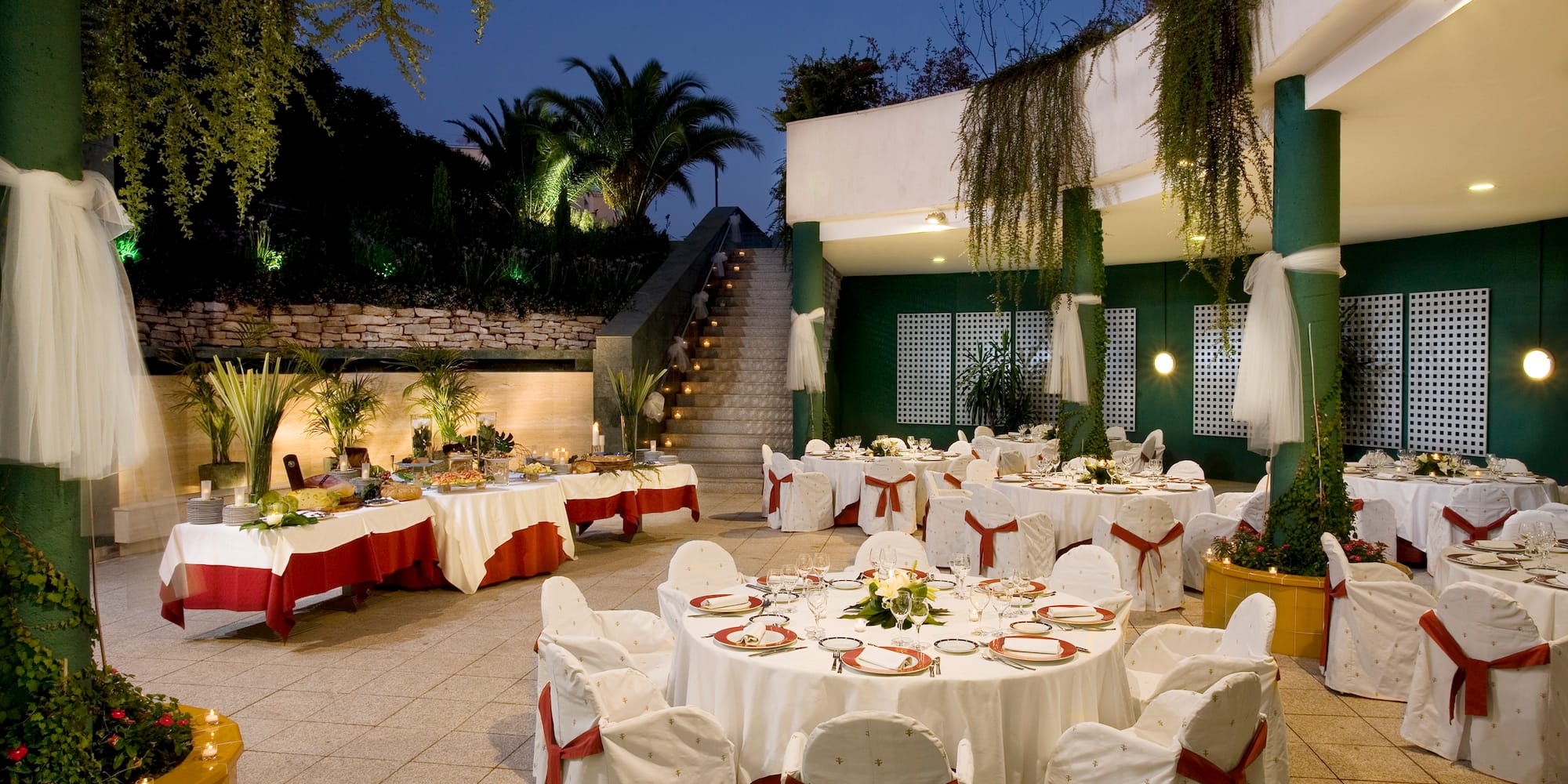 a set tables with white and red cloths